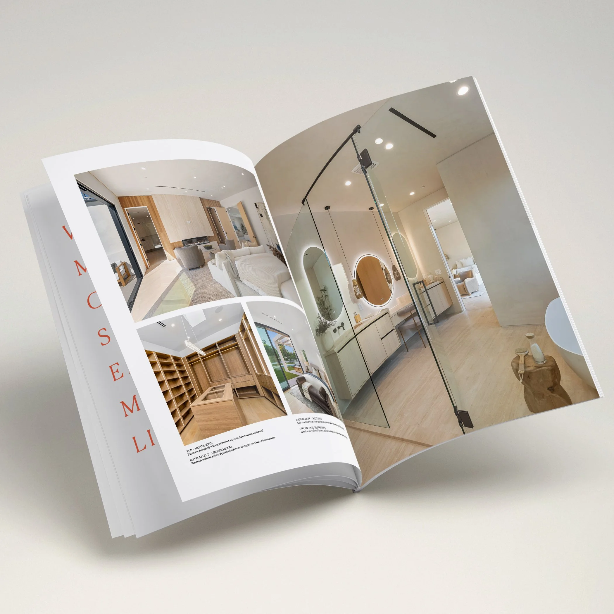 Open magazine showing interior design images and text on a white surface.