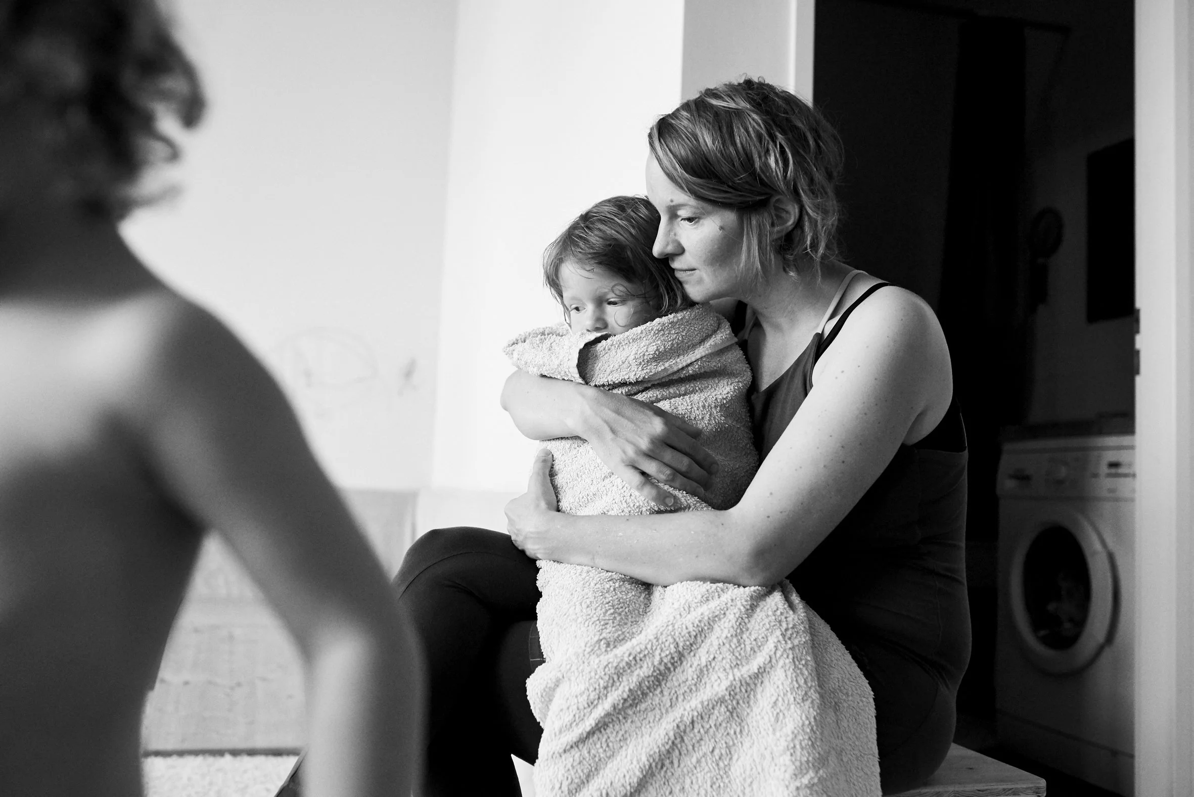 mother holding her daughter