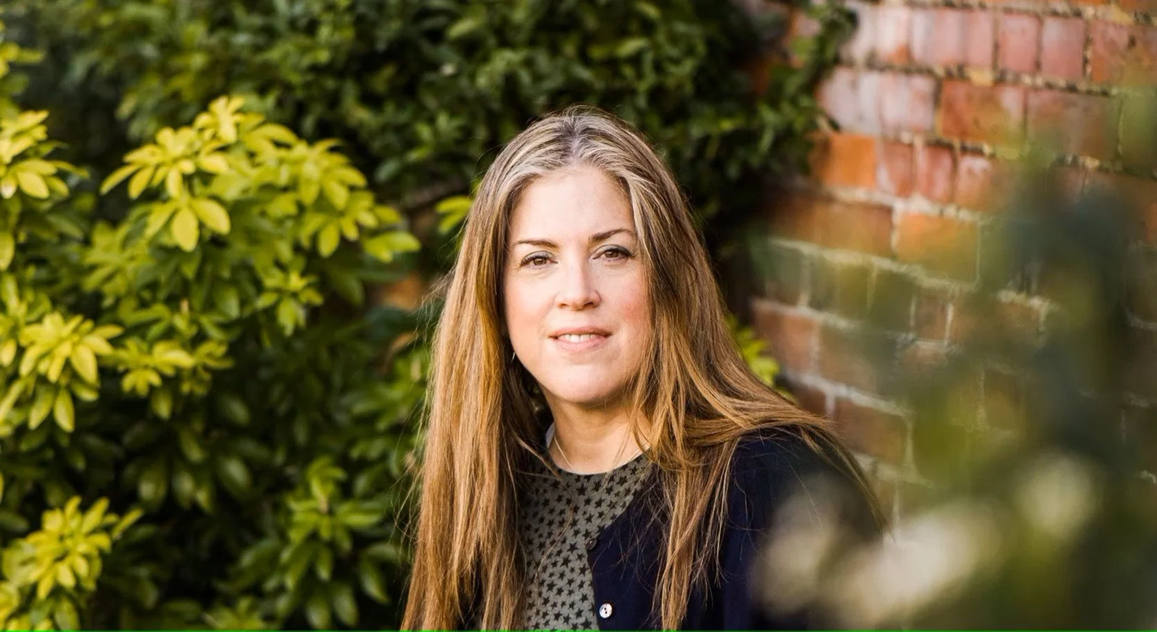 Clair Neill, psychotherapist, in a garden