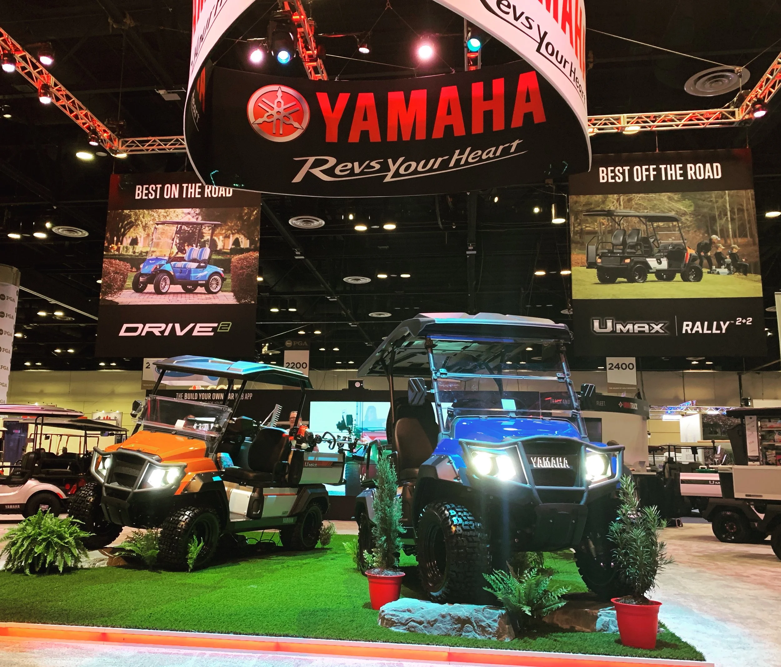 Yamaha golf car trade show booth at the PGA Show showcasing product lineup and marketing display
