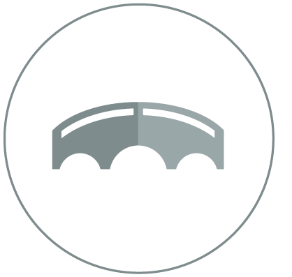 A gray, stylized bridge icon with a white circular background and a black border.