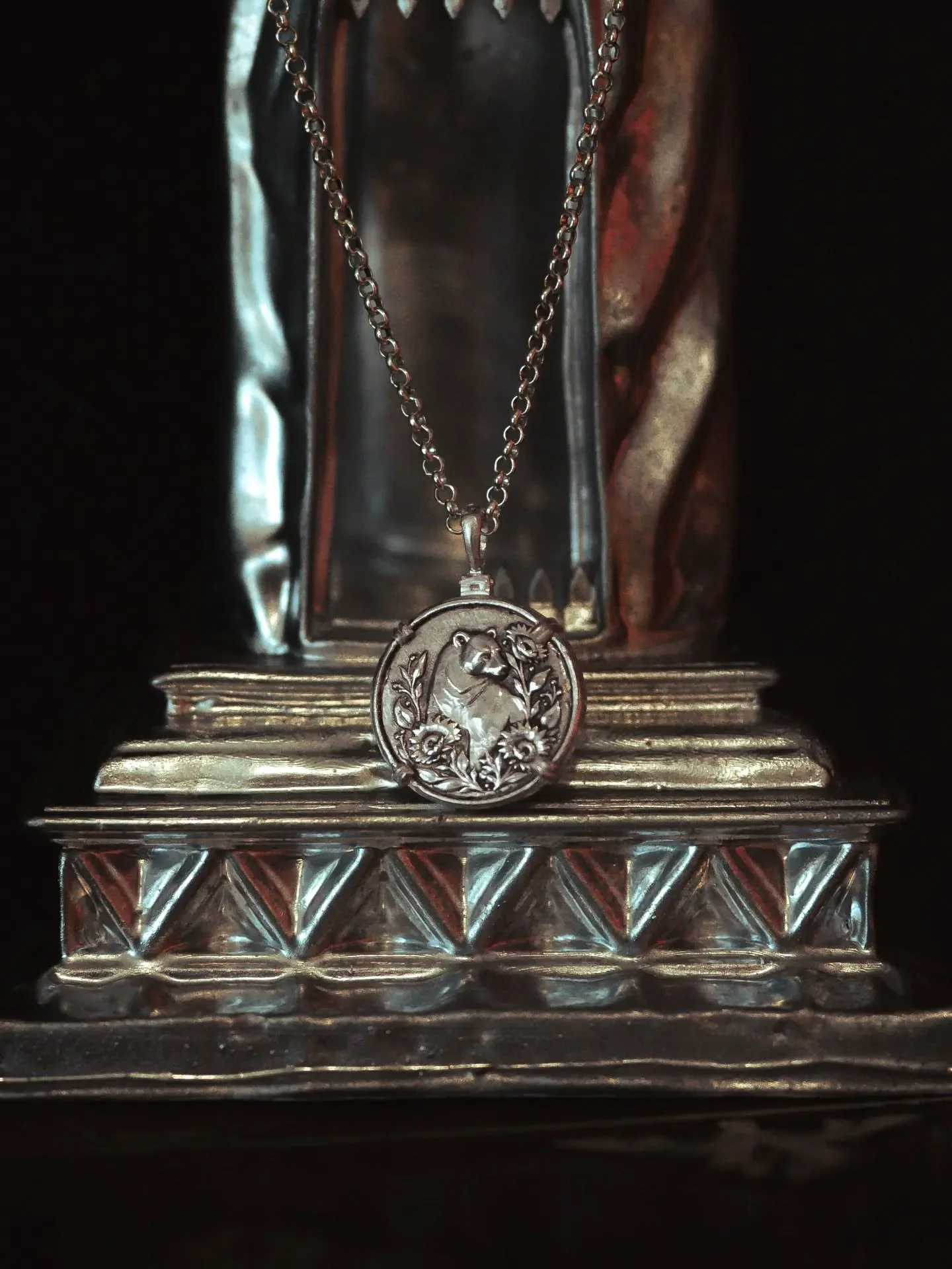 The pendant version of the Charon&rsquo;s Obol pieces, made in sterling silver.

This one carries a bear with sunflowers for Heath King, worked as a small double-sided relic, with the carved image held on one face and personalised text on the reverse