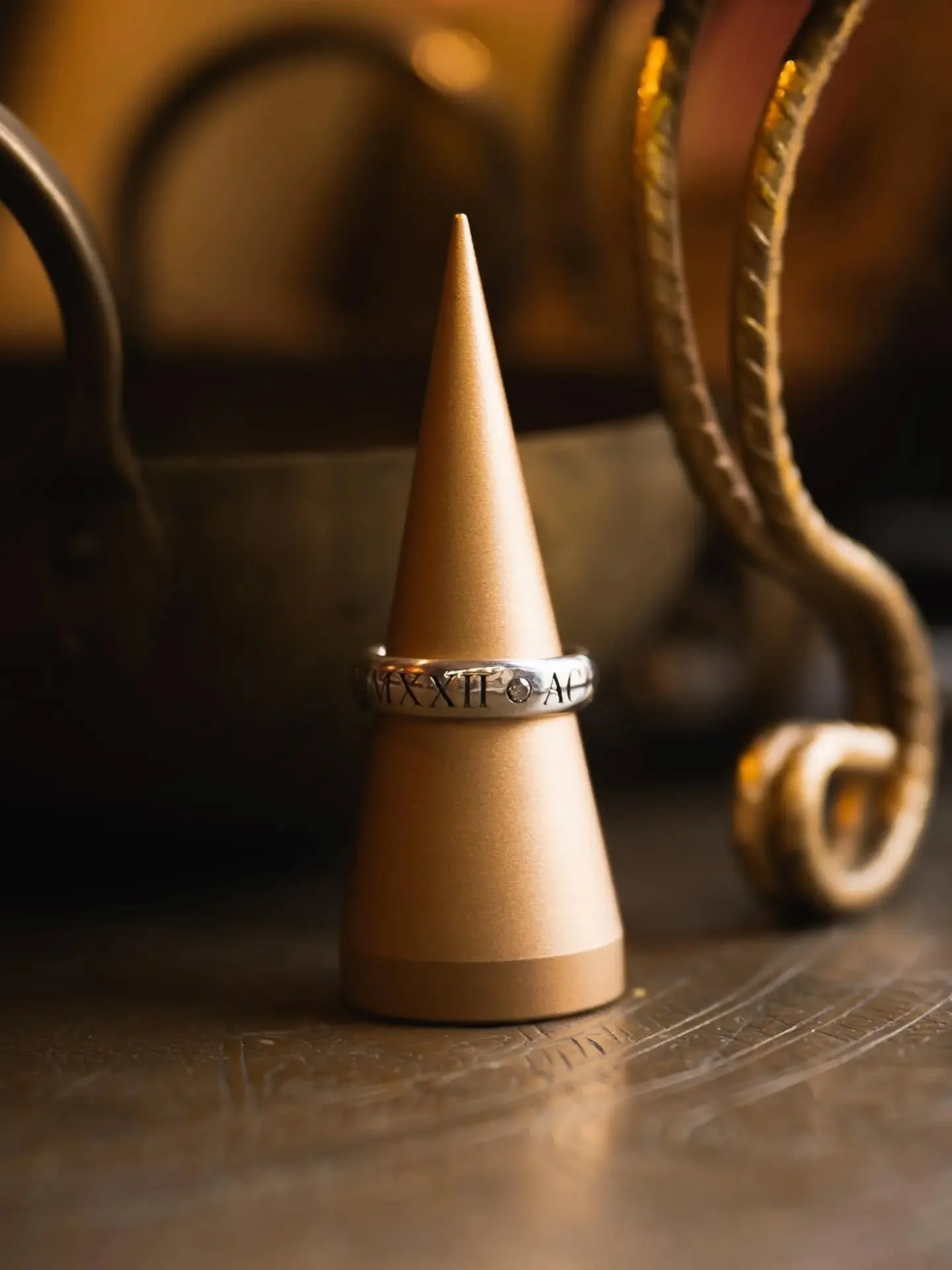 Thank you Athol.

A sterling silver commission, engraved with initials and the date they first met, with flush-set white and black diamonds placed between the details around the band.

A clean, understated piece made to carry something deeply persona
