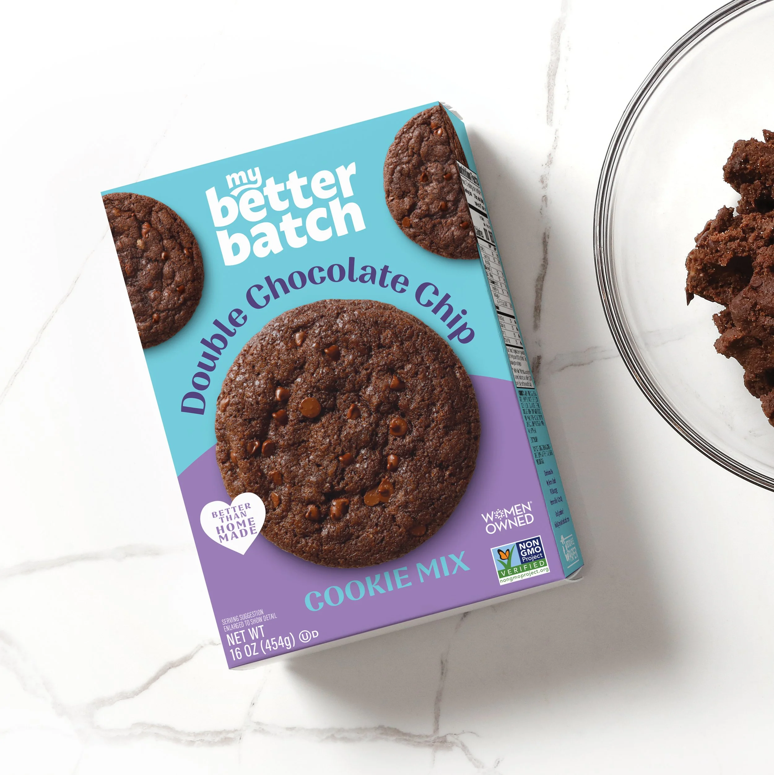 Package of my better batch double chocolate chip cookie mix on a white marble surface