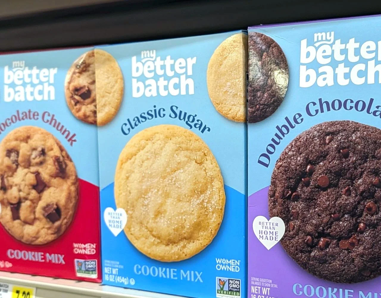 Boxes of cookie mix with flavors: Chocolate Chunk, Classic Sugar, Double Chocolate from My Better Batch brand on store shelf.