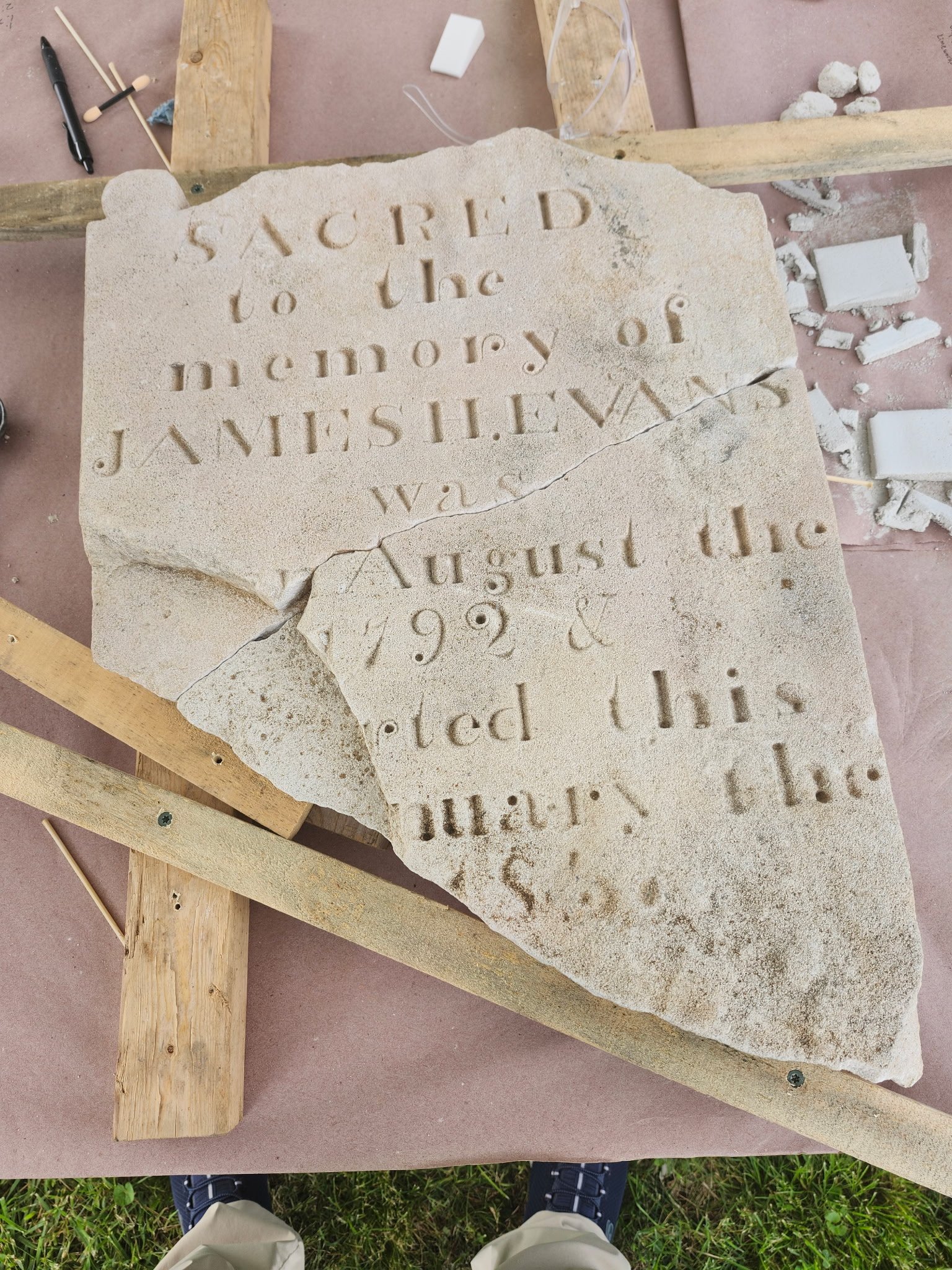 Headstone of James H. Evans in the resetting process