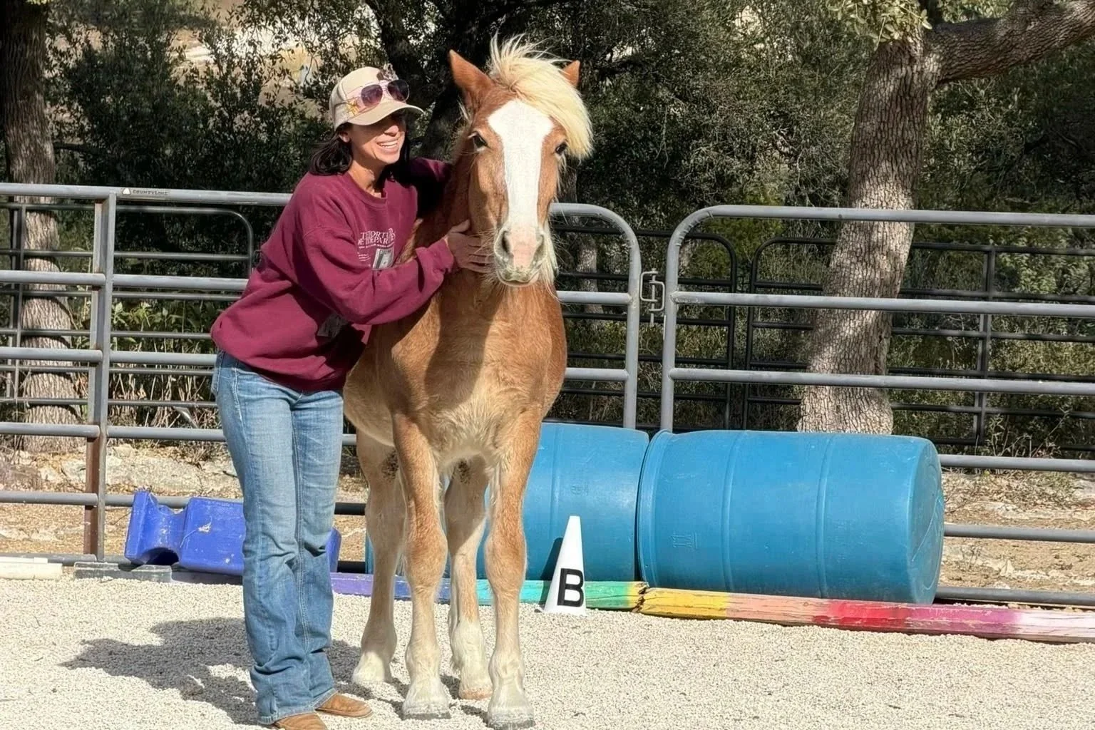 Morgan building trust with a young horse during groundwork training at The Gentle Cowgirl in Stockdale, TX — trust-based colt starting and horse training near San Antonio
