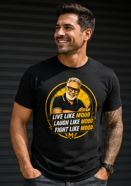 Man smiling wearing a black T-shirt with a graphic of an older man with glasses and text that says 'Live Like Mood, Laugh Like Mood, Fight Like Mood'