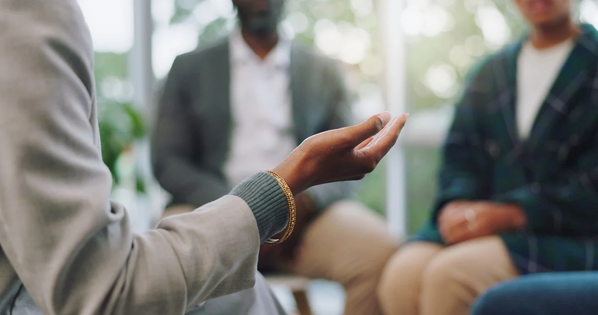 Close-up of black woman's hand gesturing in an uplifting manner