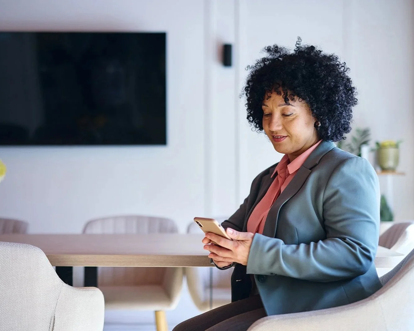 Executive woman sitting and making a phone call