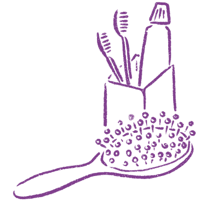 Toothbrushes and toothpaste in a cup on a plate with sprinkles.