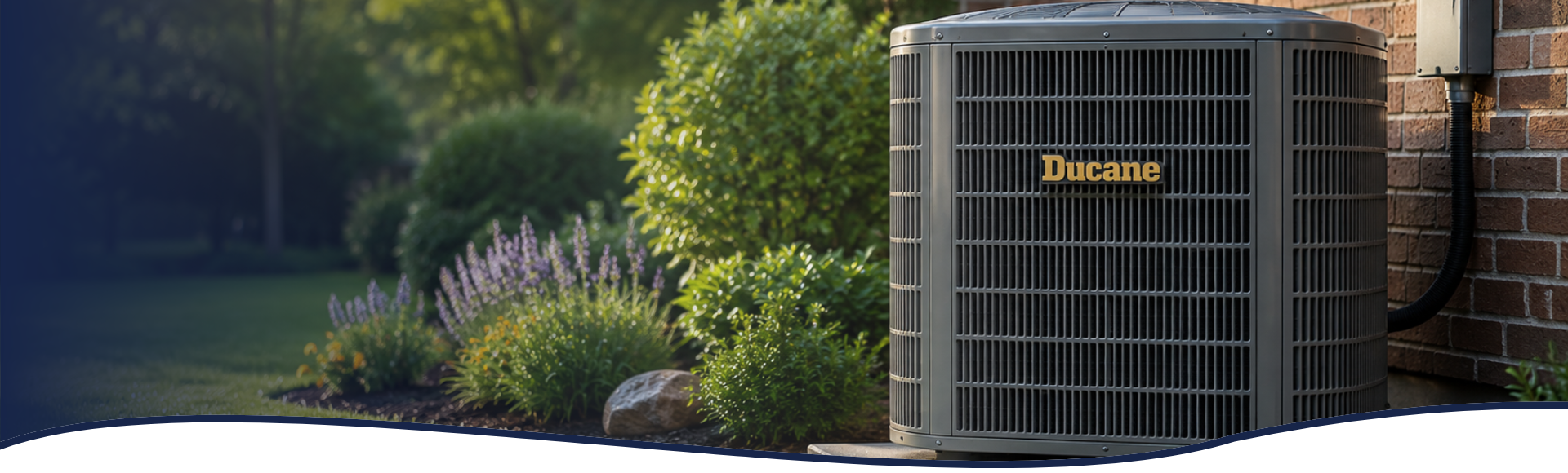 An Energy-Efficient Ducane Air Conditioner installed outside a residential home with spring landscaping