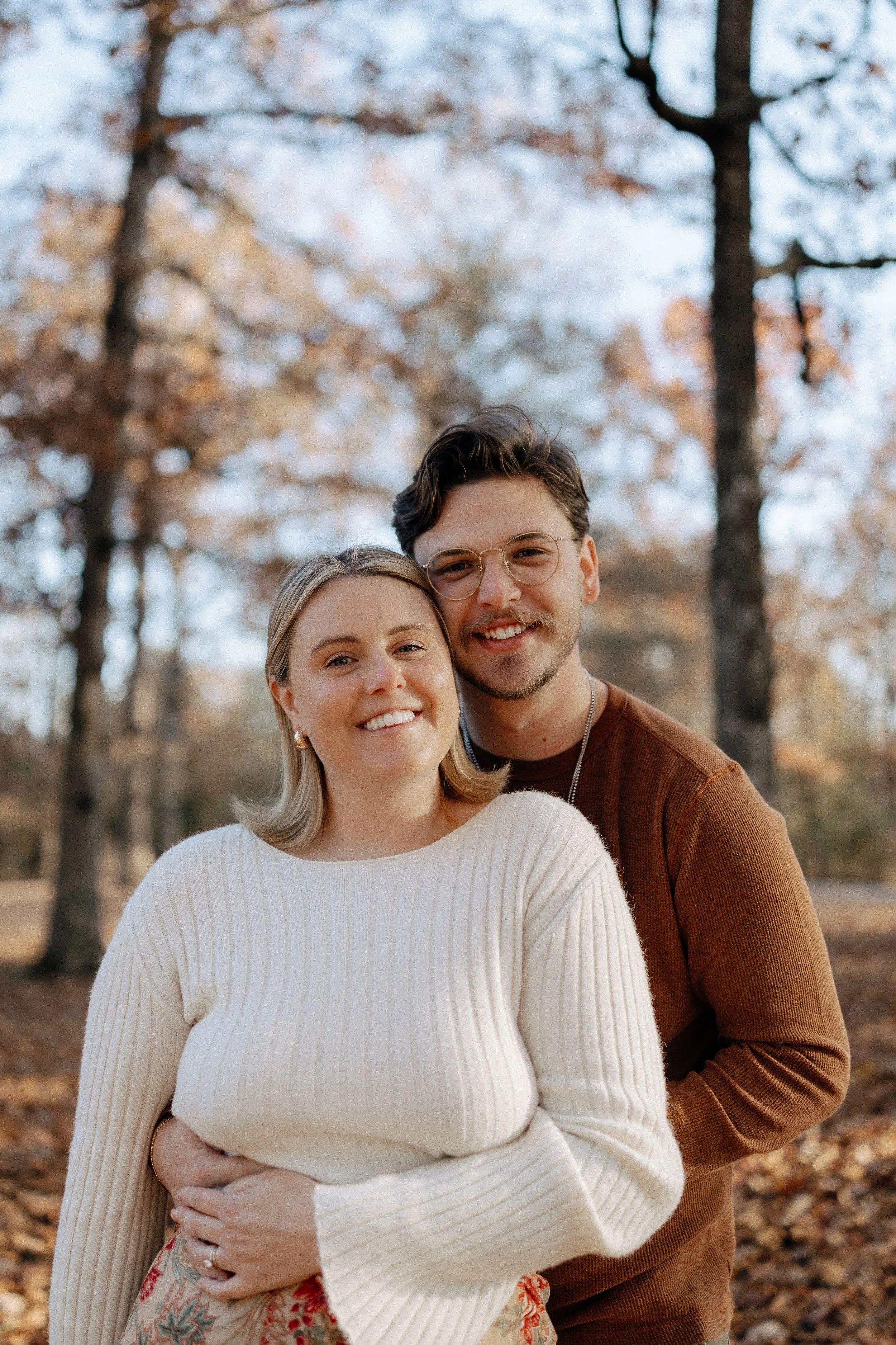 R Photos photographer Rachel Kosky and her husband embracing and smiling in a Tennessee woodland during fall, warm tones and soft natural light — documentary wedding photographer in Chattanooga, TN