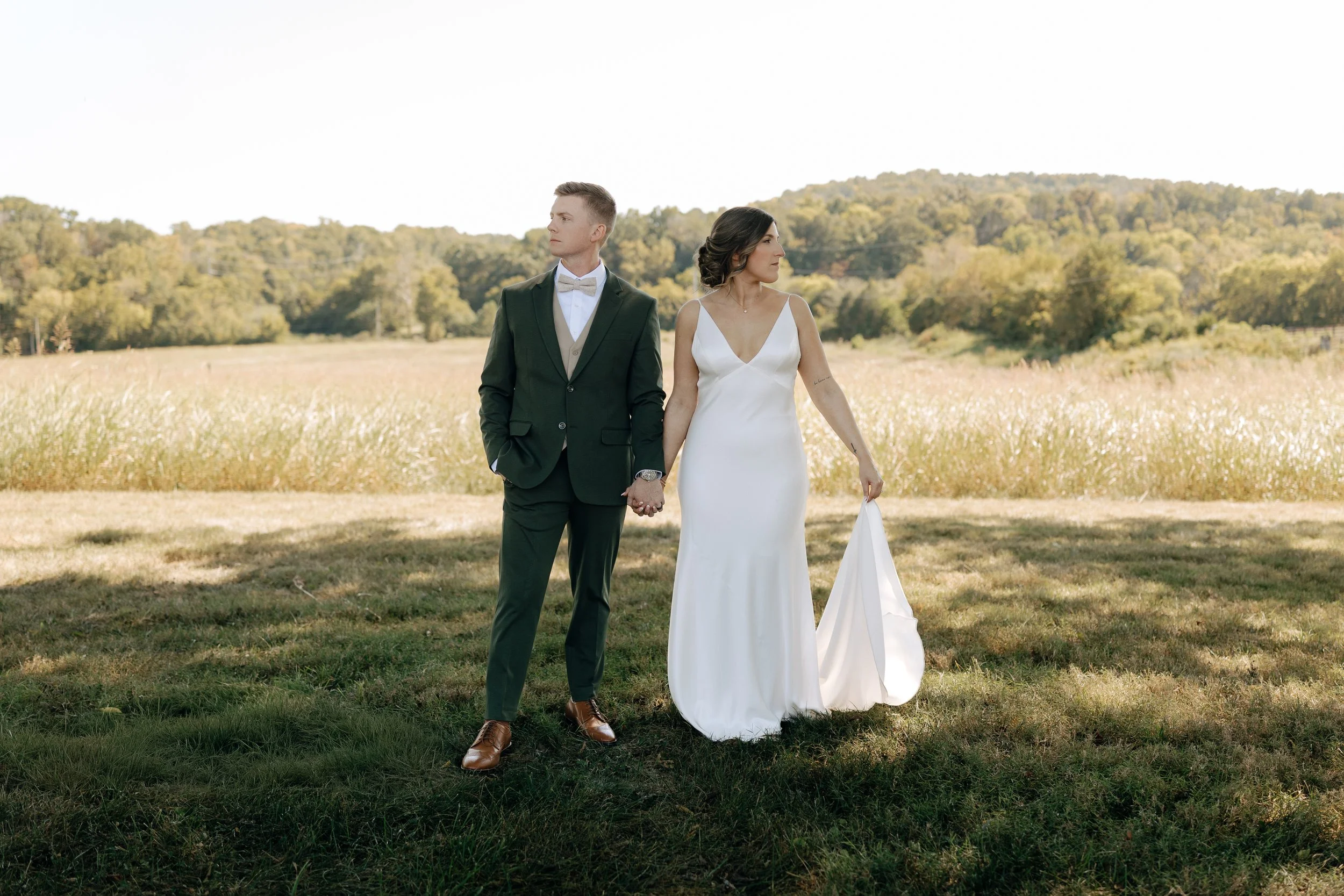Timeless and simple bride and good standing in a field before wedding ceremony in Nashville Tennessee - Nashville Wedding Photography