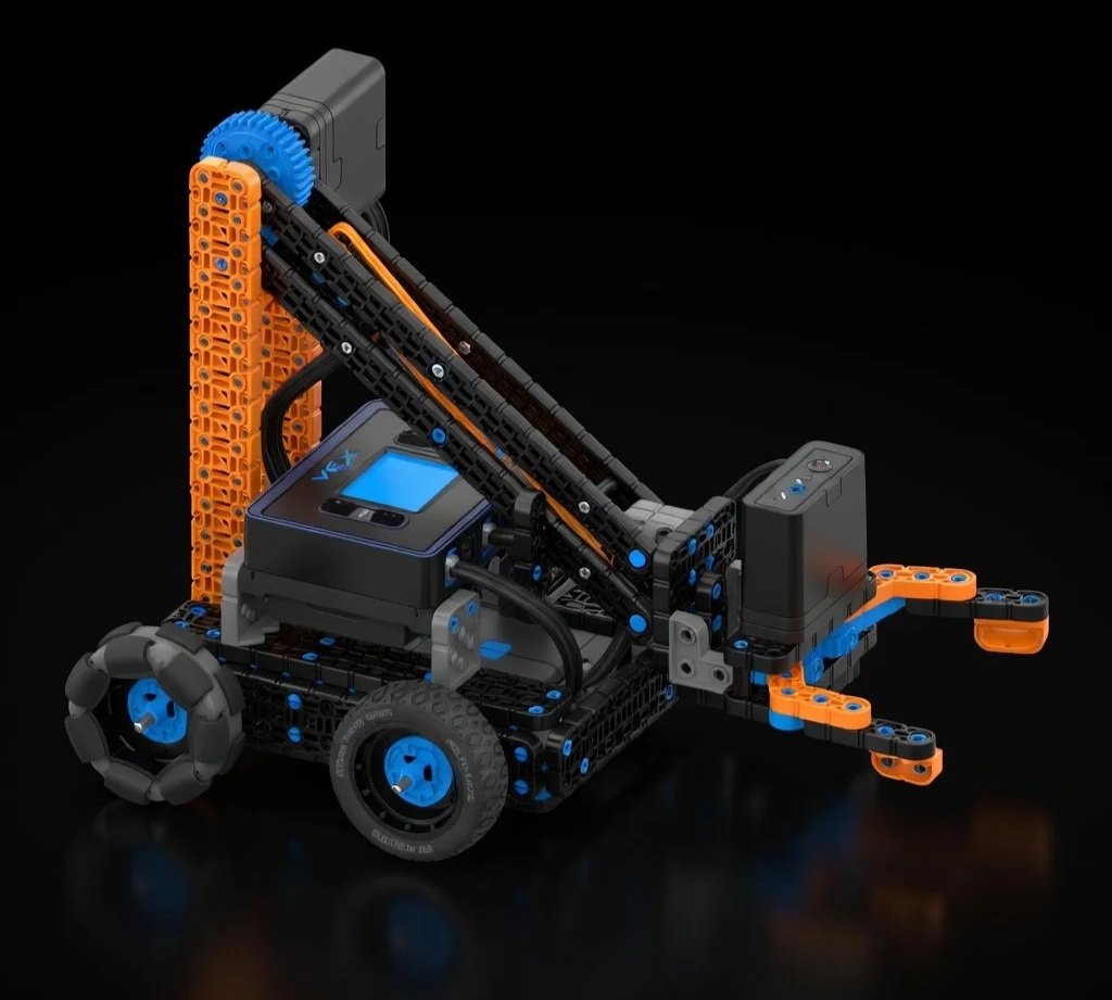 A robotic vehicle constructed from VEX pieces with gears, wheels, and a digital display, set against a black background.