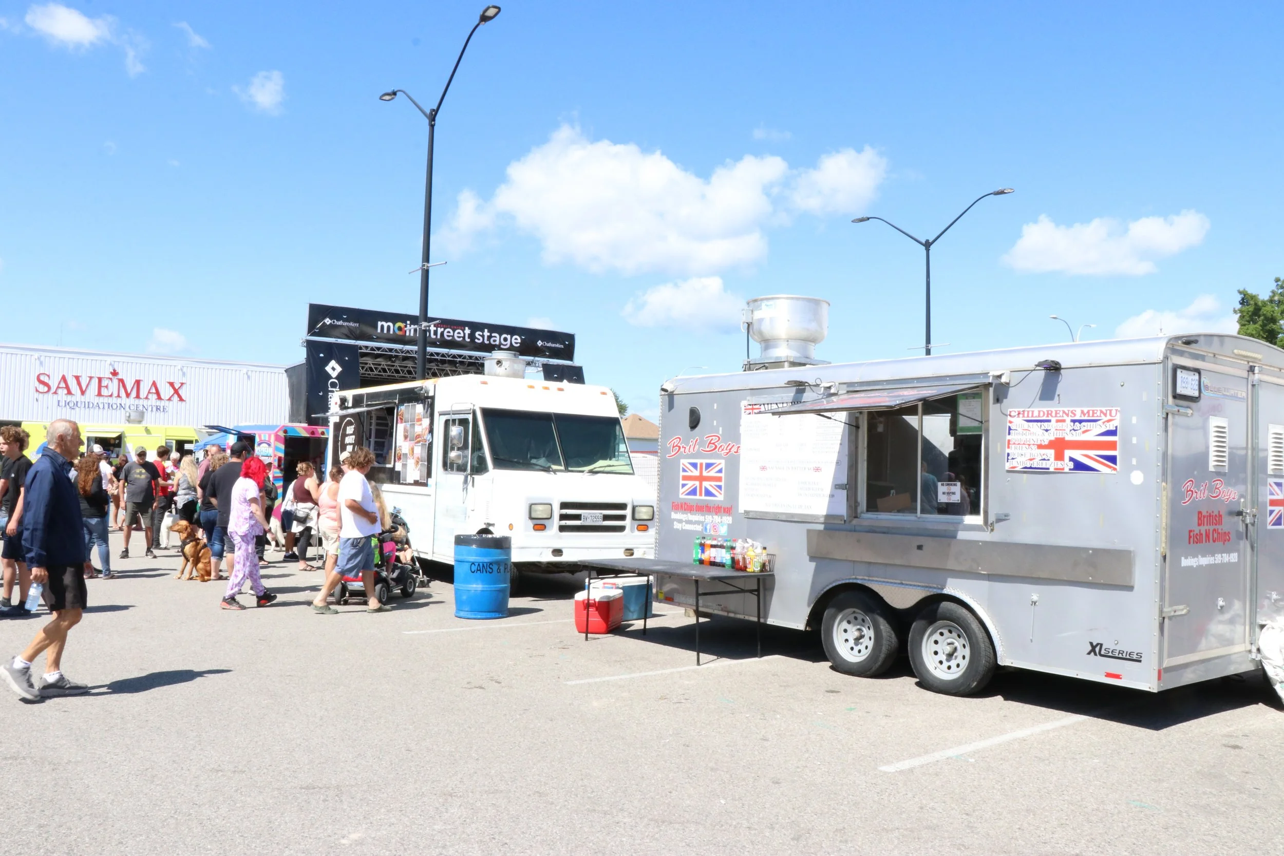 Food trucks lined in the main parking lots at WAMBO with lines of people approaching each trucks windows