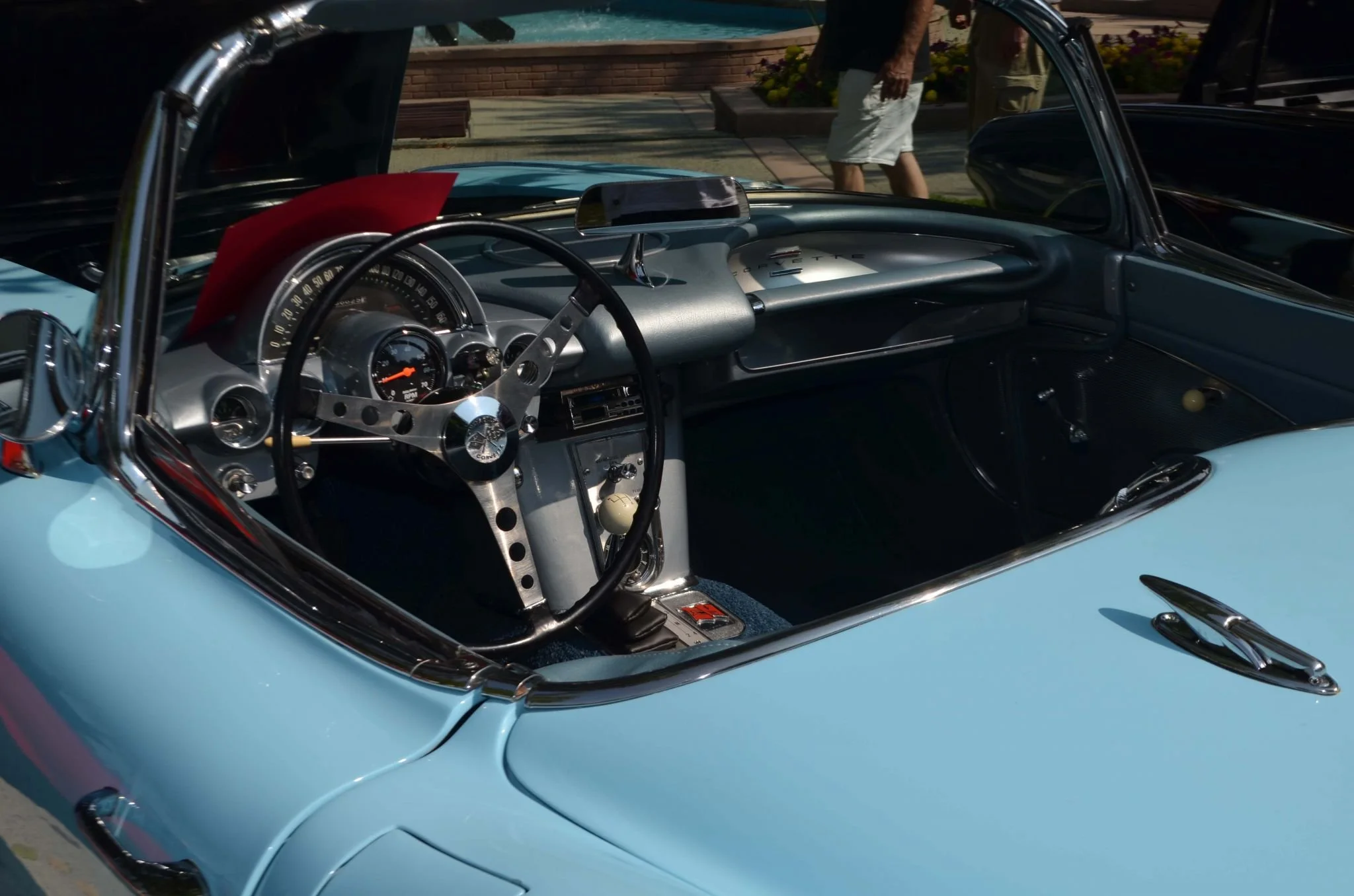 Interior of a classic light blue sports car being shown at WAMBO