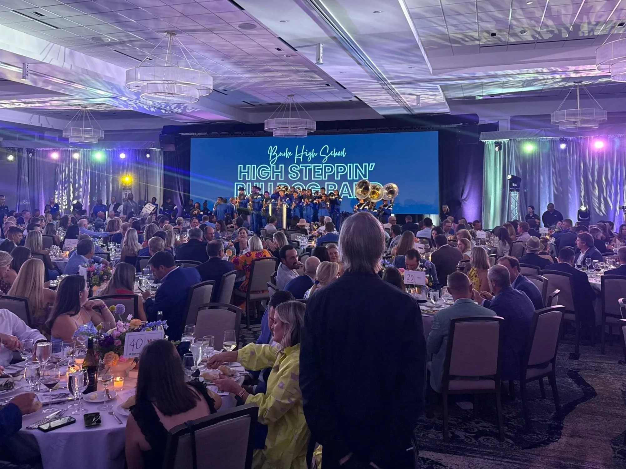 Large LED wall rental displaying custom graphics at a formal corporate gala in Charleston, SC.