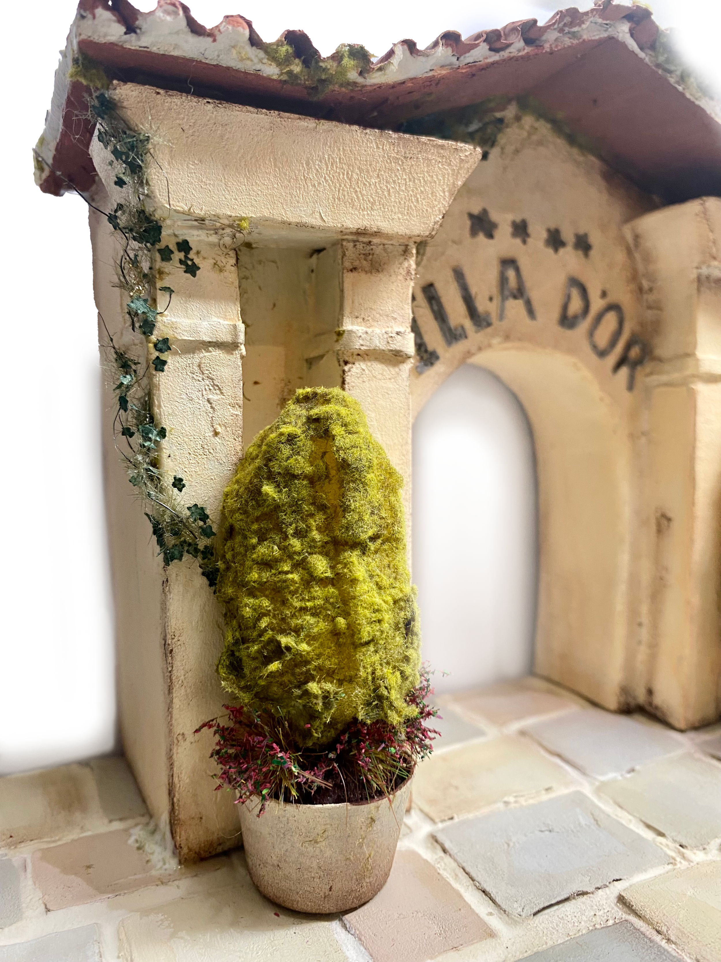 A scale model of the 'Illa D'or Hotel' entrance, commissioned as a gift, made from almost entirely recycled materials. 
