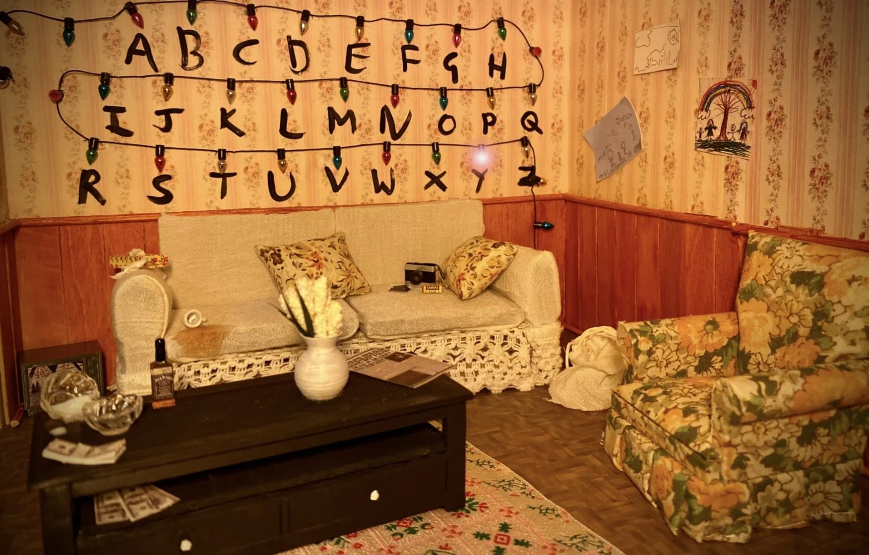 Exploring Joyce's psychological unravelling in 'Stranger Things' through a scale model of her living room, where the abandoned objects tell the story of her emotional state.