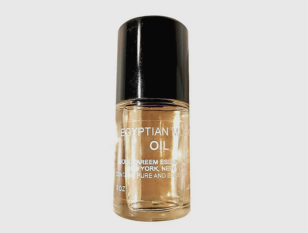 Bottle of Abdul Kareem Egyptian Musk™ oil with a black cap and transparent body showing light-colored fragrance oil inside.