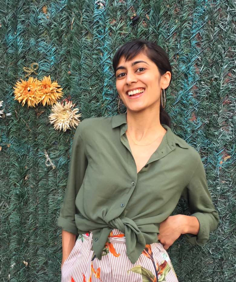 portrait of noreen masih in front of a green gate