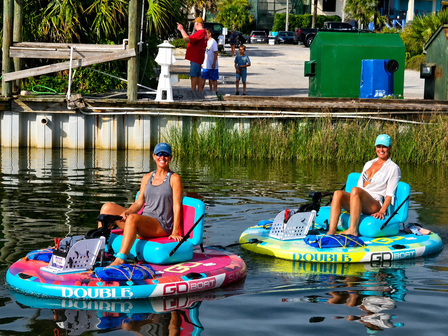 Two guests enjoying Pensacola Beach Float Boats on Little Sabine Bay near Sabine Marina in Pensacola Beach, Florida
