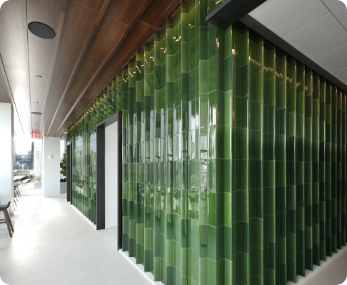 Interior with green tiled wall and wooden ceiling, modern design.
