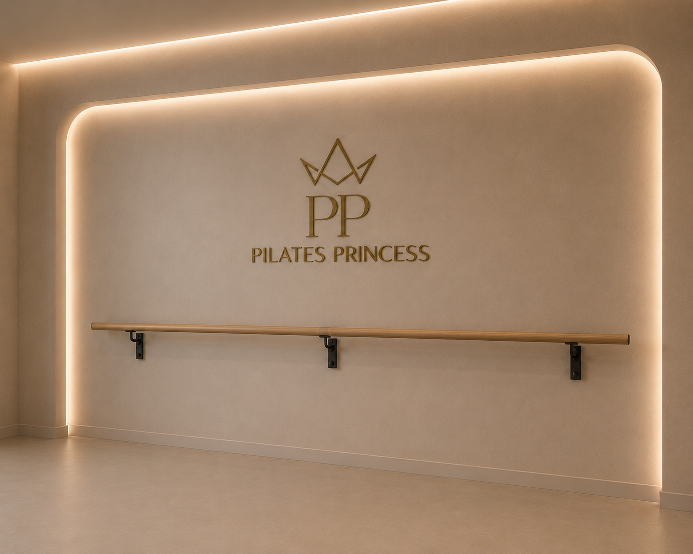 Minimalist beige-wall interior with a wooden ballet barre mounted on black brackets, illuminated by soft warm lighting. The wall features a gold logo with a crown symbol and the letters 'PP', along with the text 'Pilates Princess' underneath, indicating a Pilates studio or boutique.