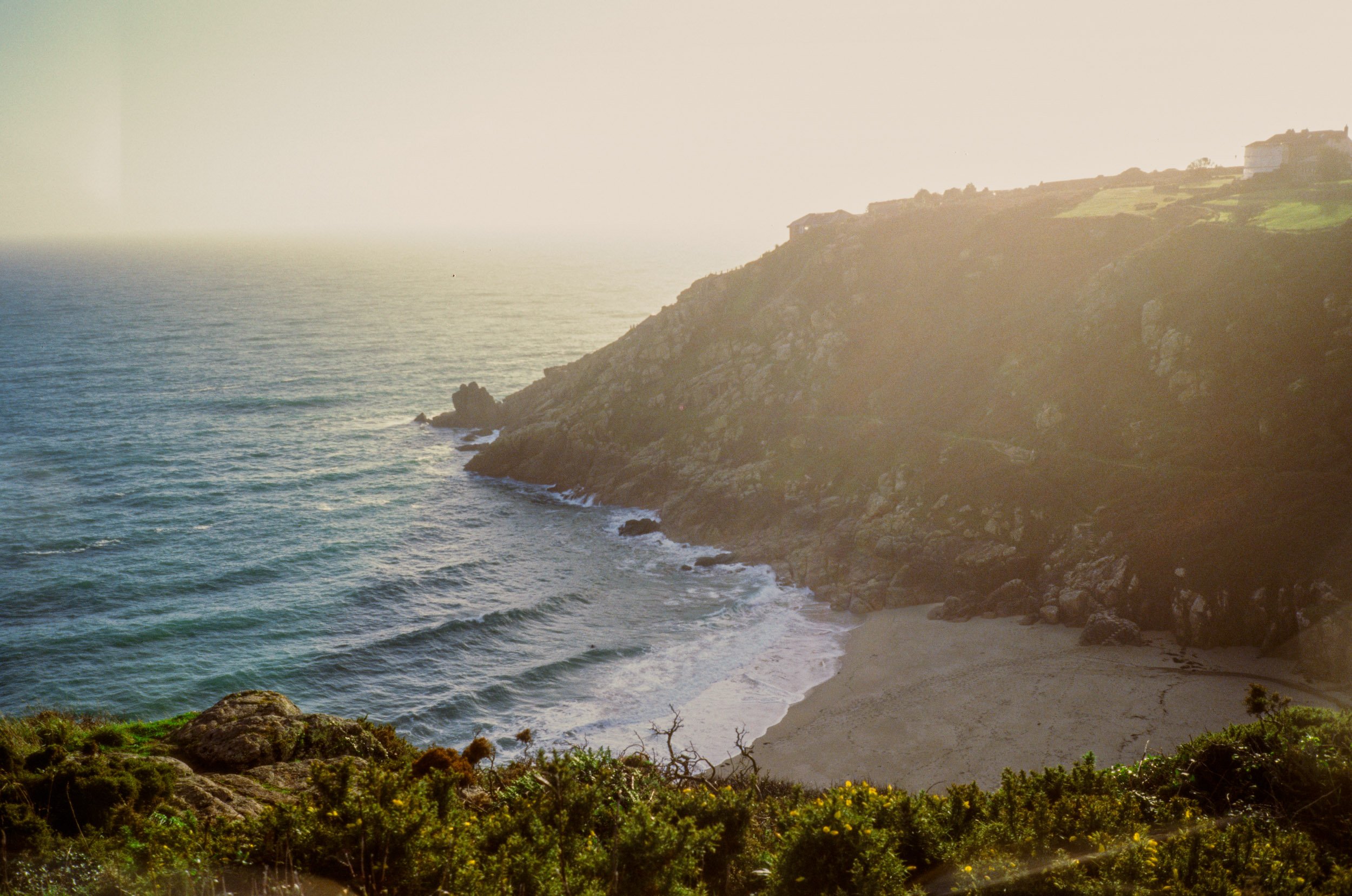 The cove in golden sea mist
