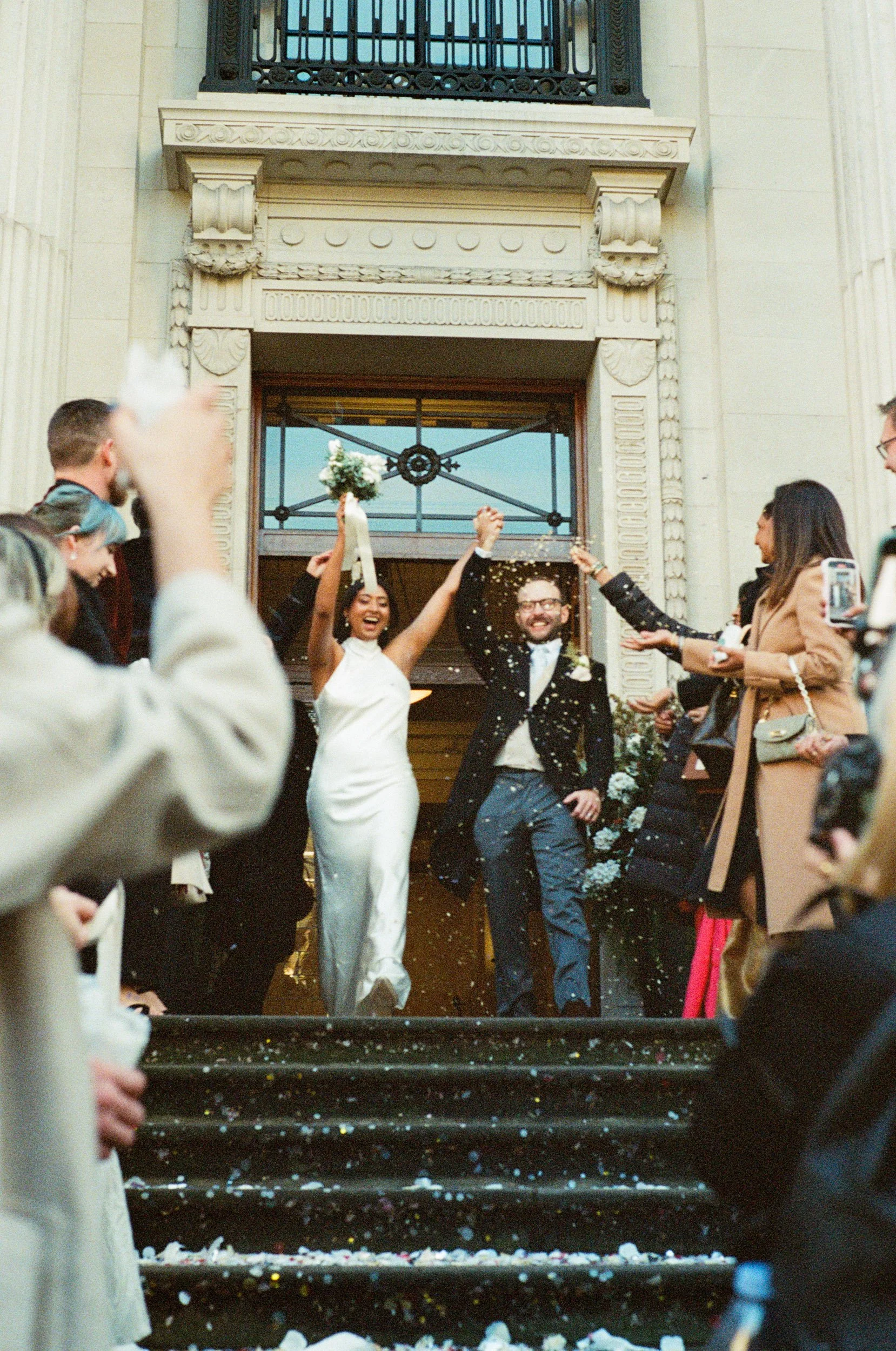 Confetti thrown over a newly married couple on the town hall steps