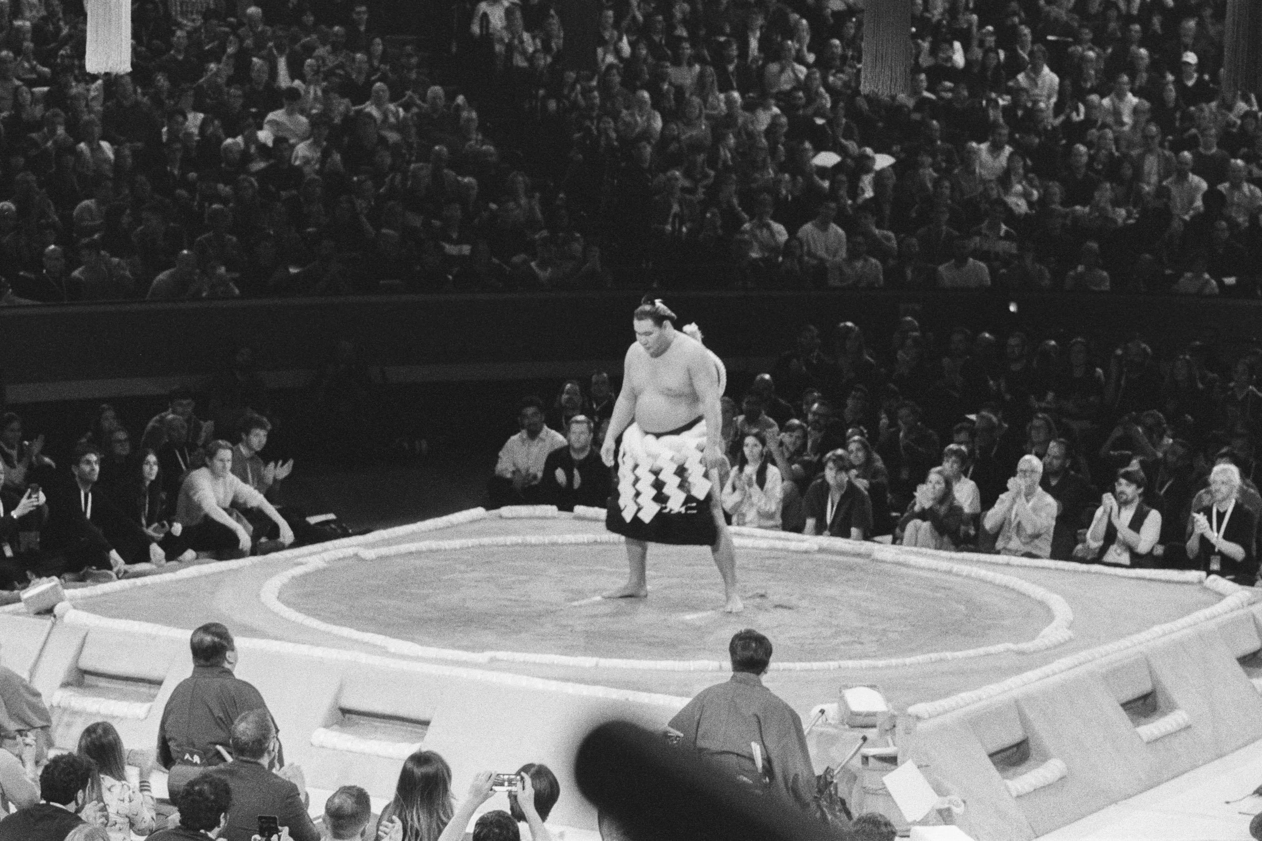 Yokozuna ring-entering ceremony before a packed arena