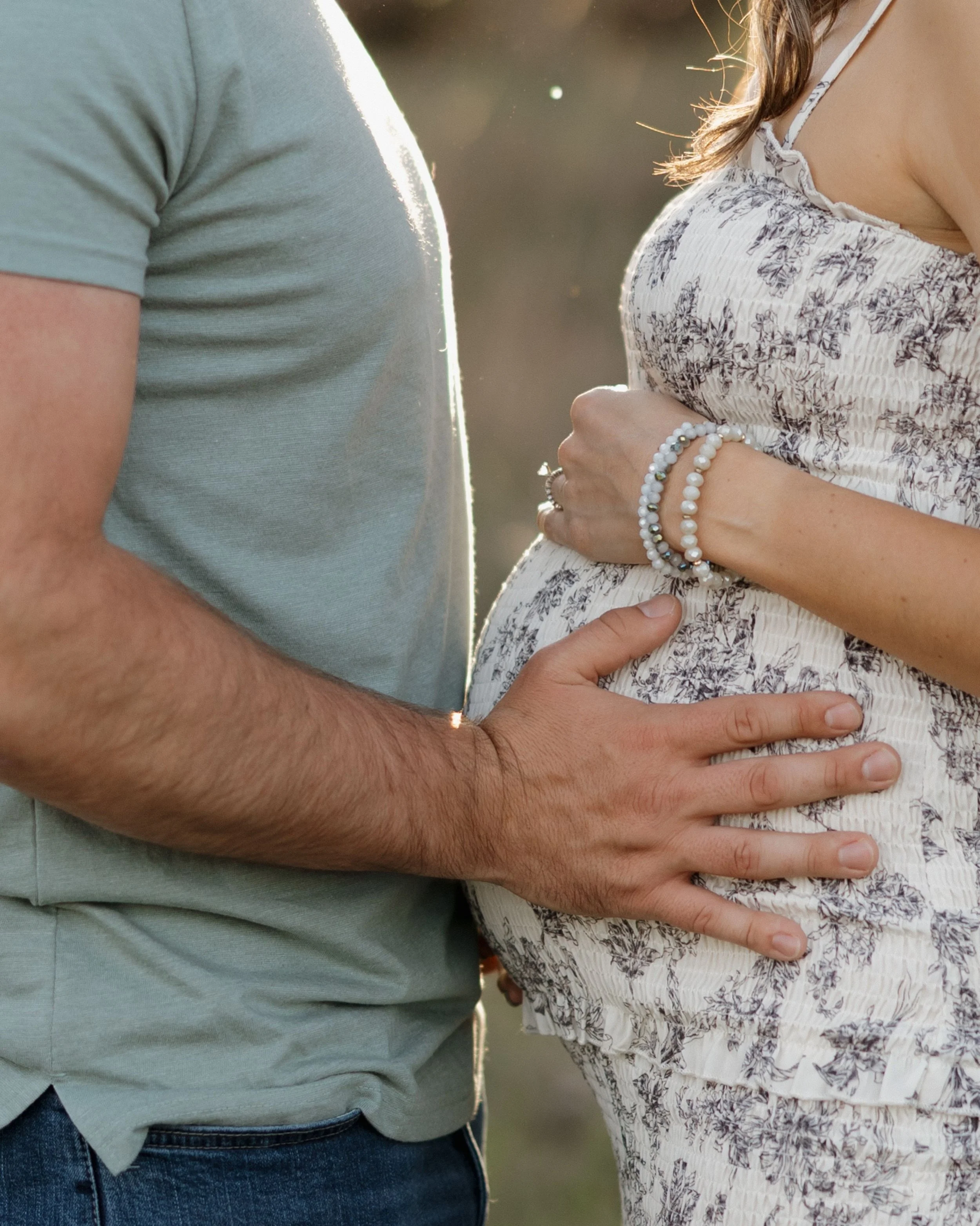 Golden hour, a fluffy white dog who had his own agenda, and two people so ready to become parents. Truly one of my favorite kinds of evenings.

The way they moved together so naturally, with that warm golden light filtering through the trees behind t
