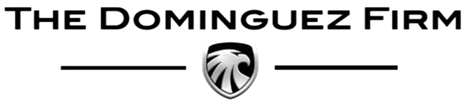 Logo of The Dominguez Firm featuring a stylized lion's head emblem.