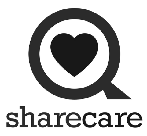 Sharecare logo featuring a magnifying glass with a heart inside and the word 'sharecare' below.