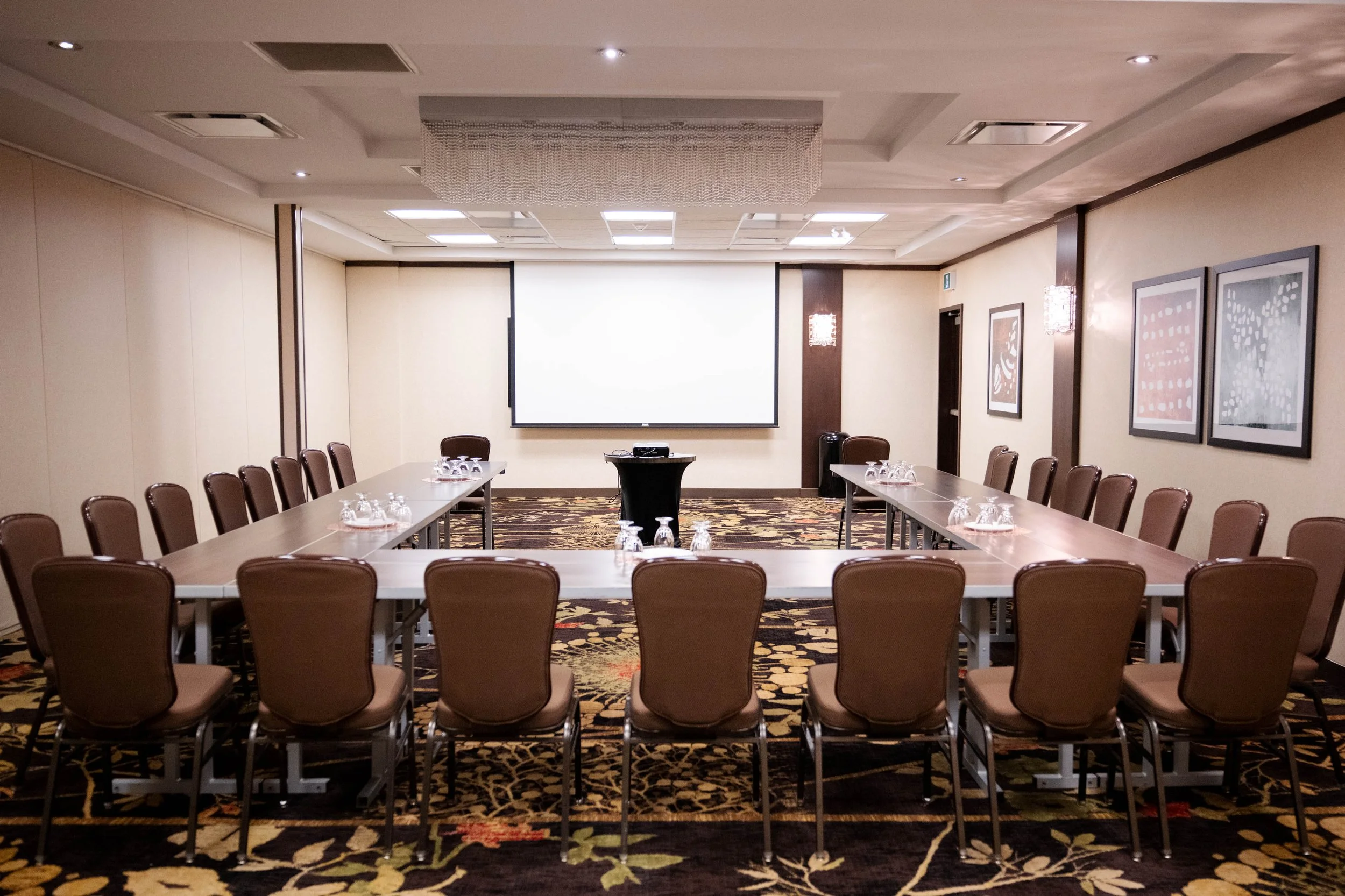 Meeting room with tables and chairs set up in a U-shape book your next meeting and corporate event at Best Western Plus Edmonton Airport Hotel