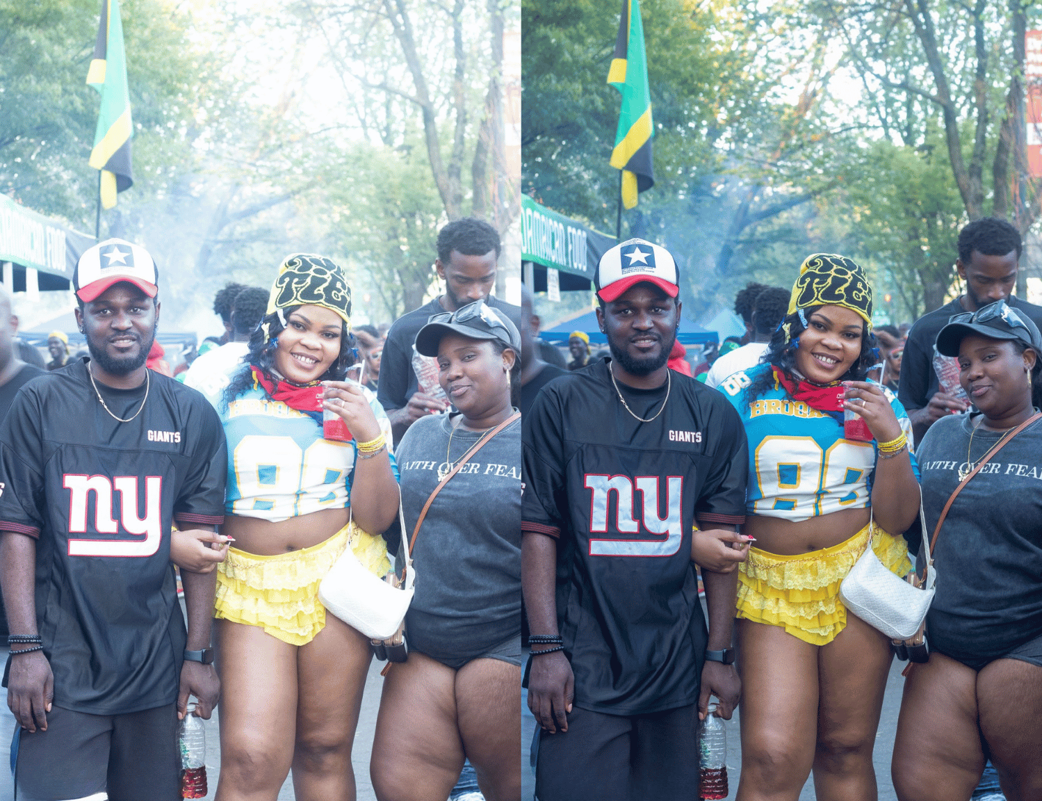 Three people standing at an outdoor event, with two men and a woman in the center. They are dressed casually, and there are trees and a crowd in the background.