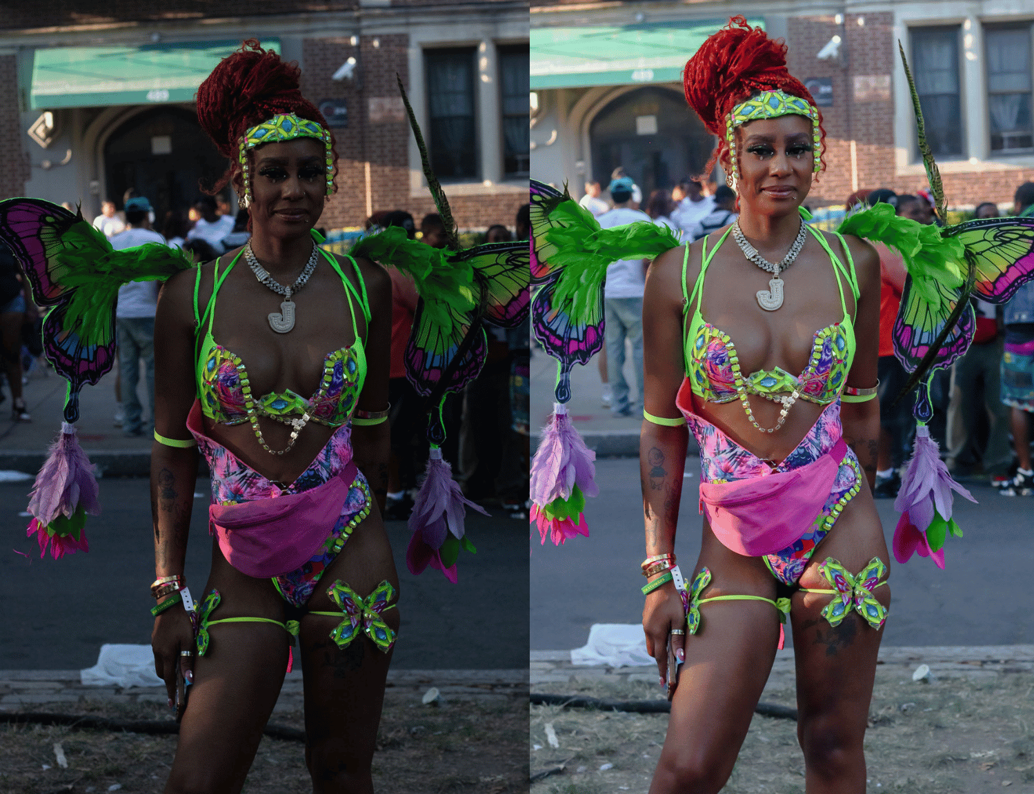 A woman dressed in a colorful butterfly-themed costume with wings, beads, and neon accents, standing outdoors during an event or parade. She has red braids, tattoos, and jewelry, and is holding a mobile phone.