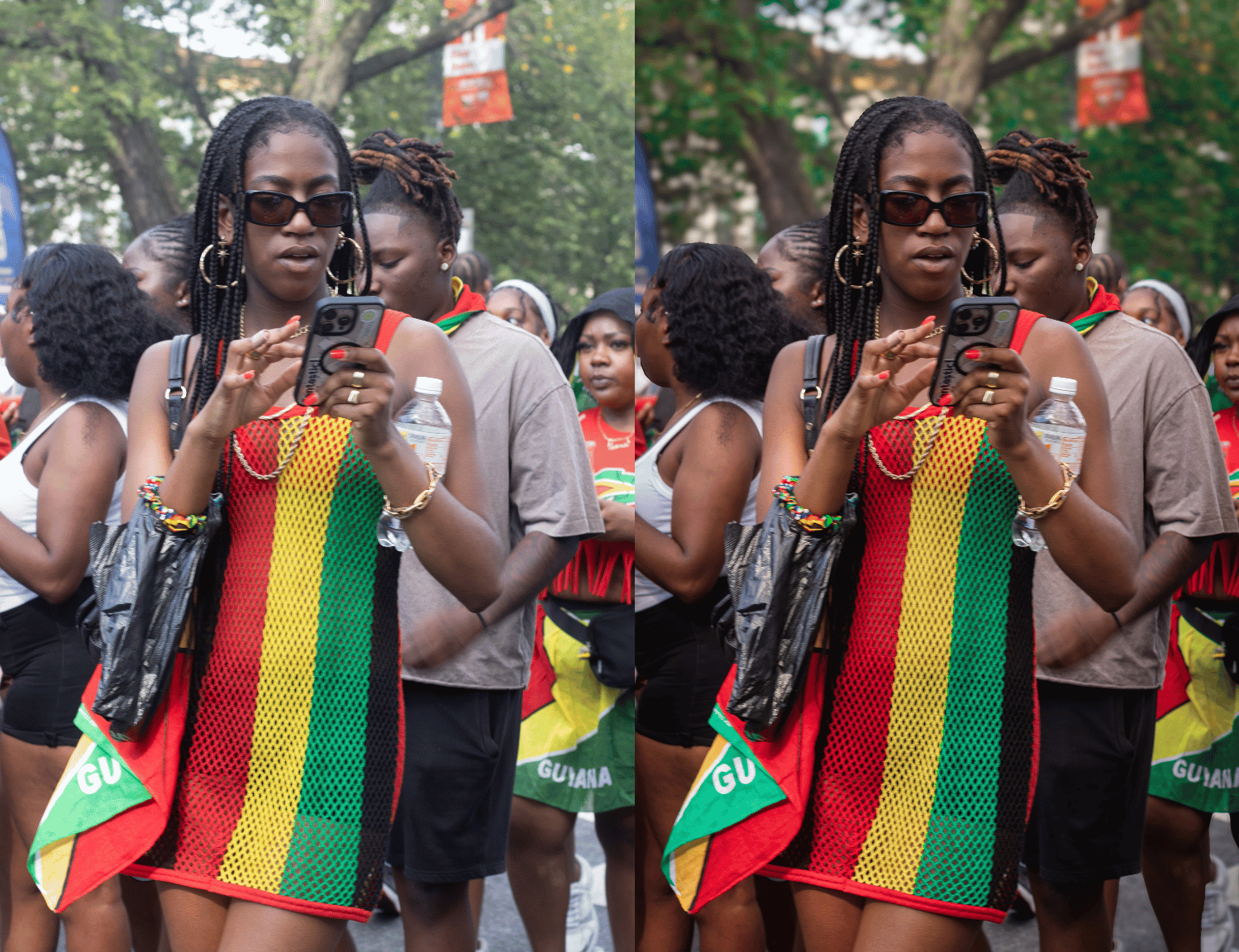 A woman wearing sunglasses and a dress with the colors and pattern of the Guyanese flag, holding a smartphone, surrounded by a crowd, some with Guyanese flags, outdoors with trees in the background.