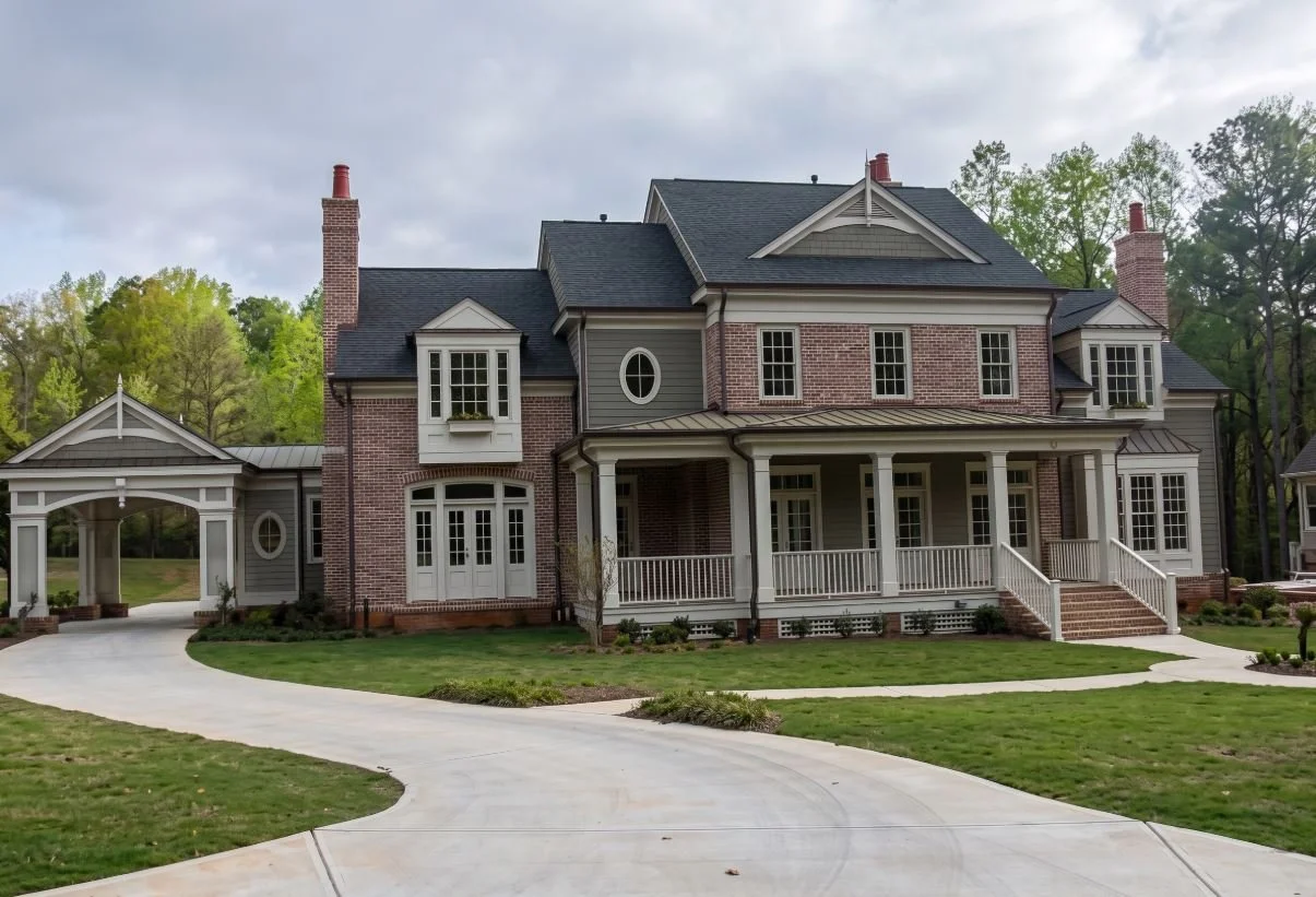 A luxury custom home exterior in Atlanta, GA, showcasing high-end architectural design and premium residential construction by Mahfoud Construction Inc.