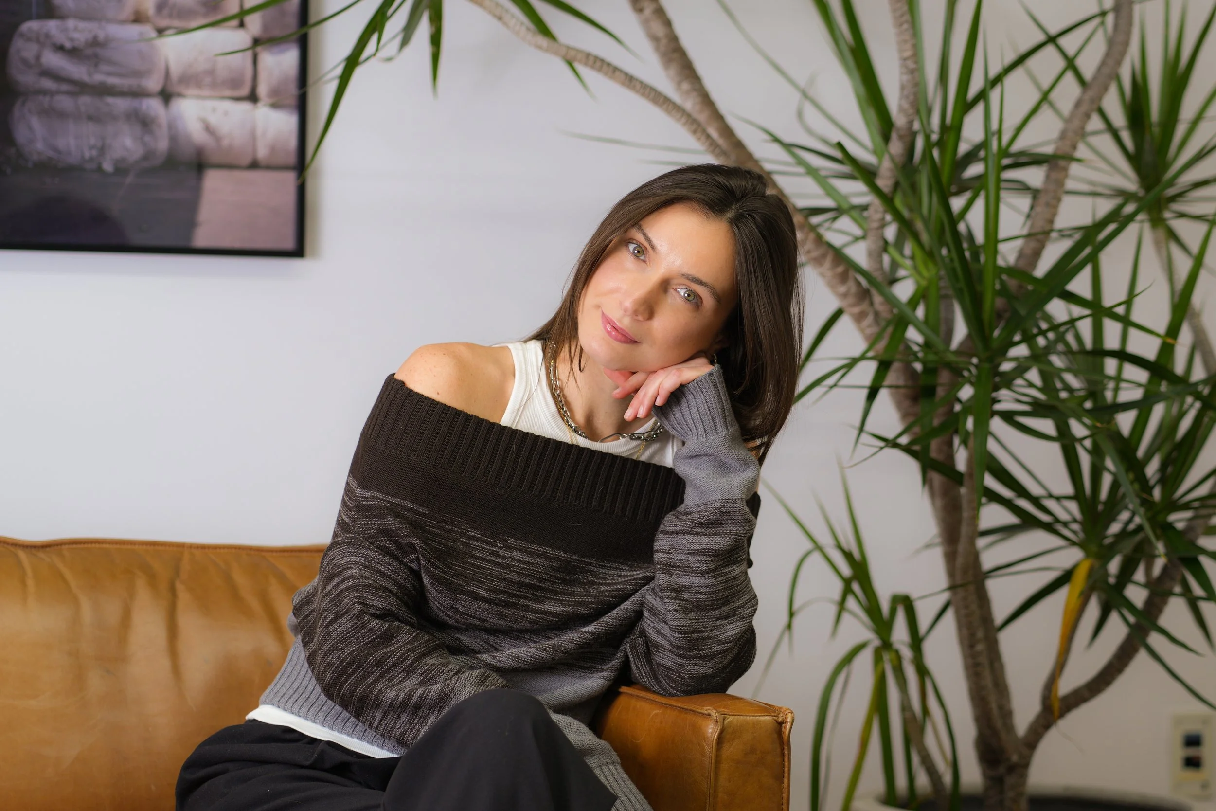 A woman with long dark hair, light skin, green eyes, and wonderful style, and she's offering her personal styling, personal shopping, and wardrobe edit consulting services. She is the best in Toronto and Canada. She is here to elevate your style.