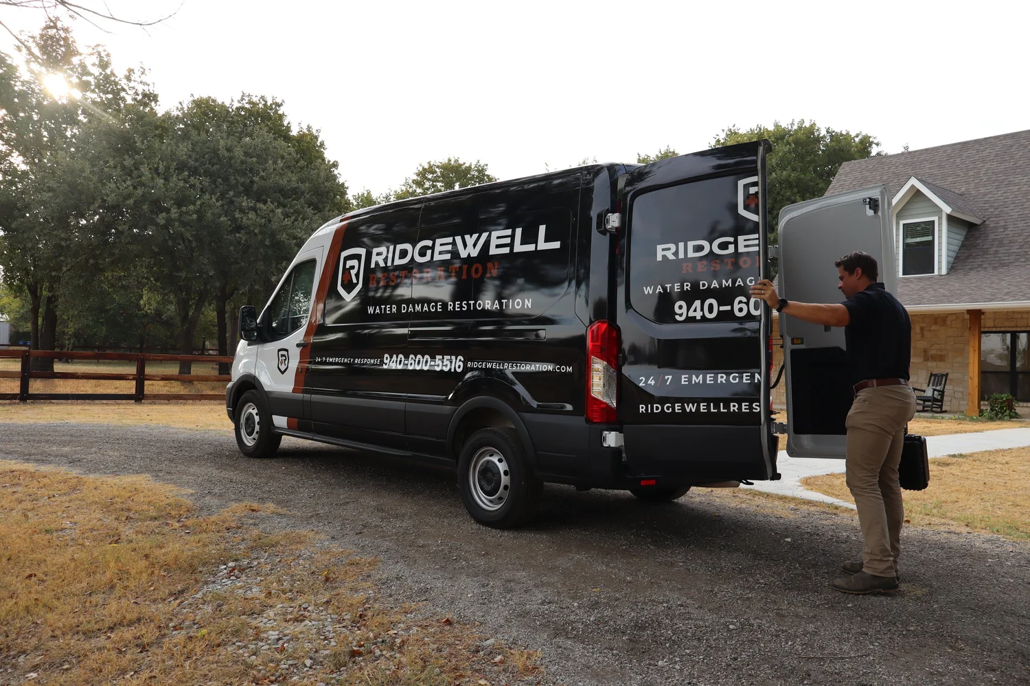 Ridgewell Restoration technician beside the company response van