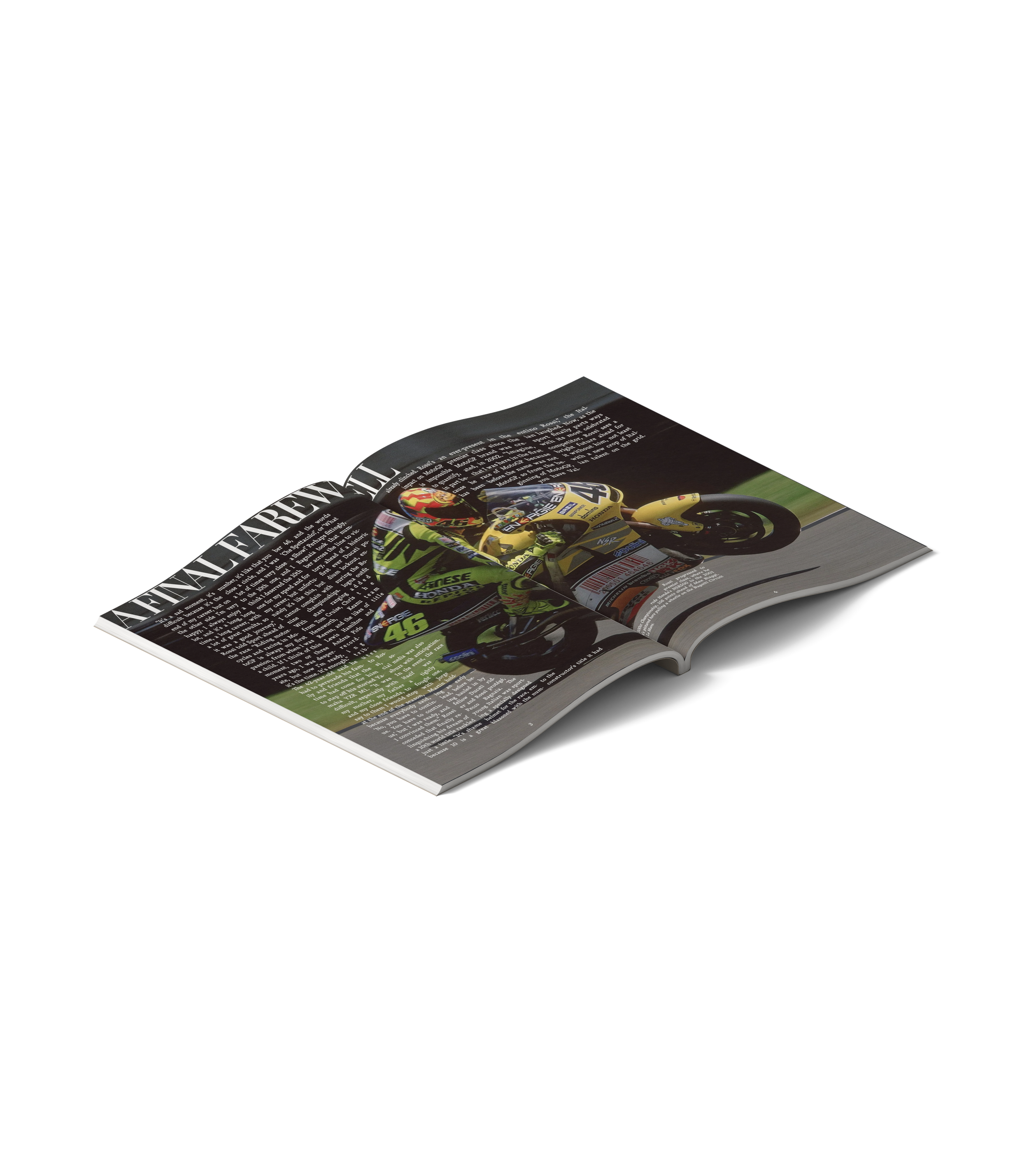 Open magazine featuring a racing motorcycle and articles, with visible headline text.