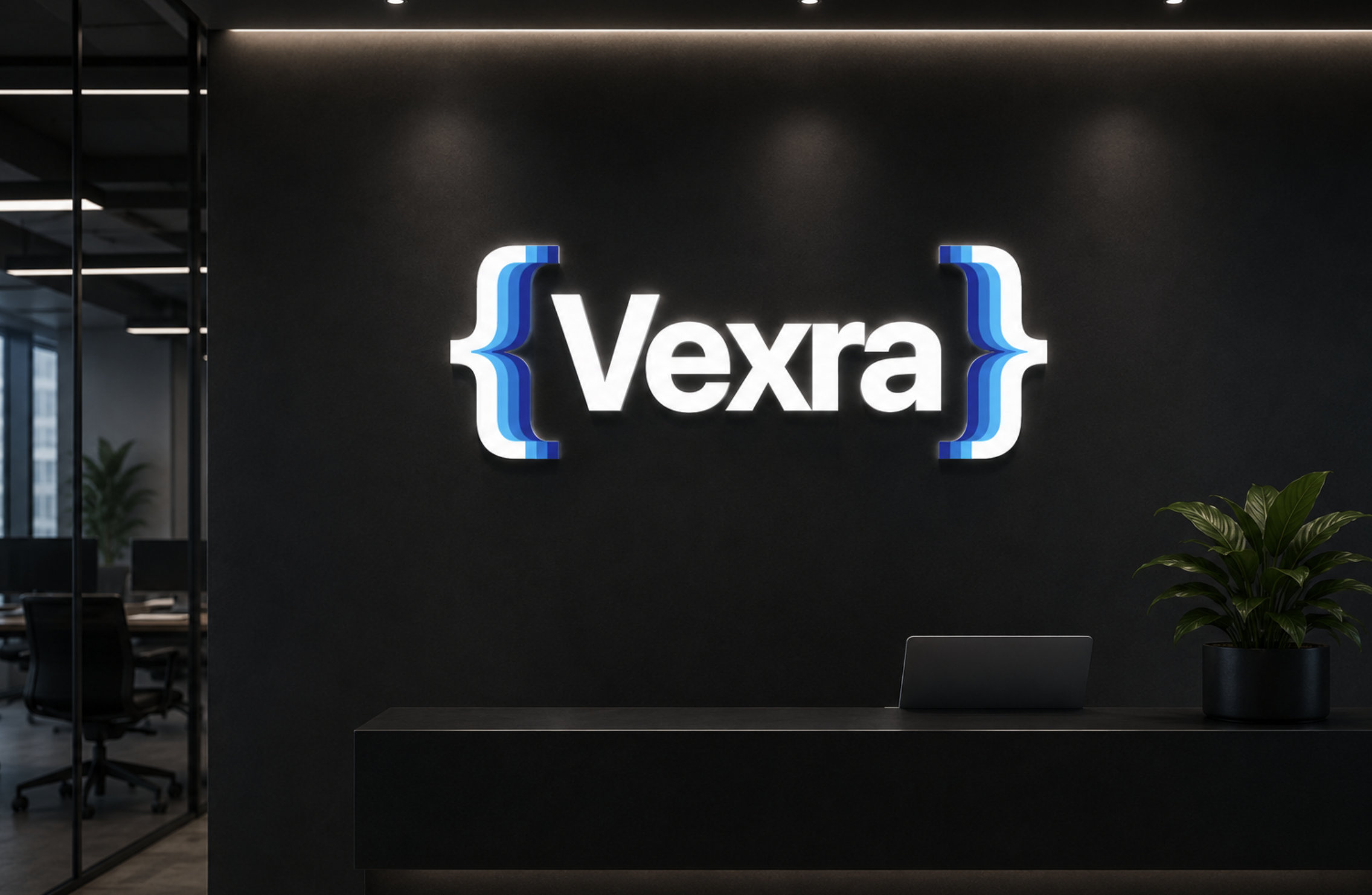 A modern office reception desk with a dark wall behind it and a illuminated Vexra logo in brackets on the wall.