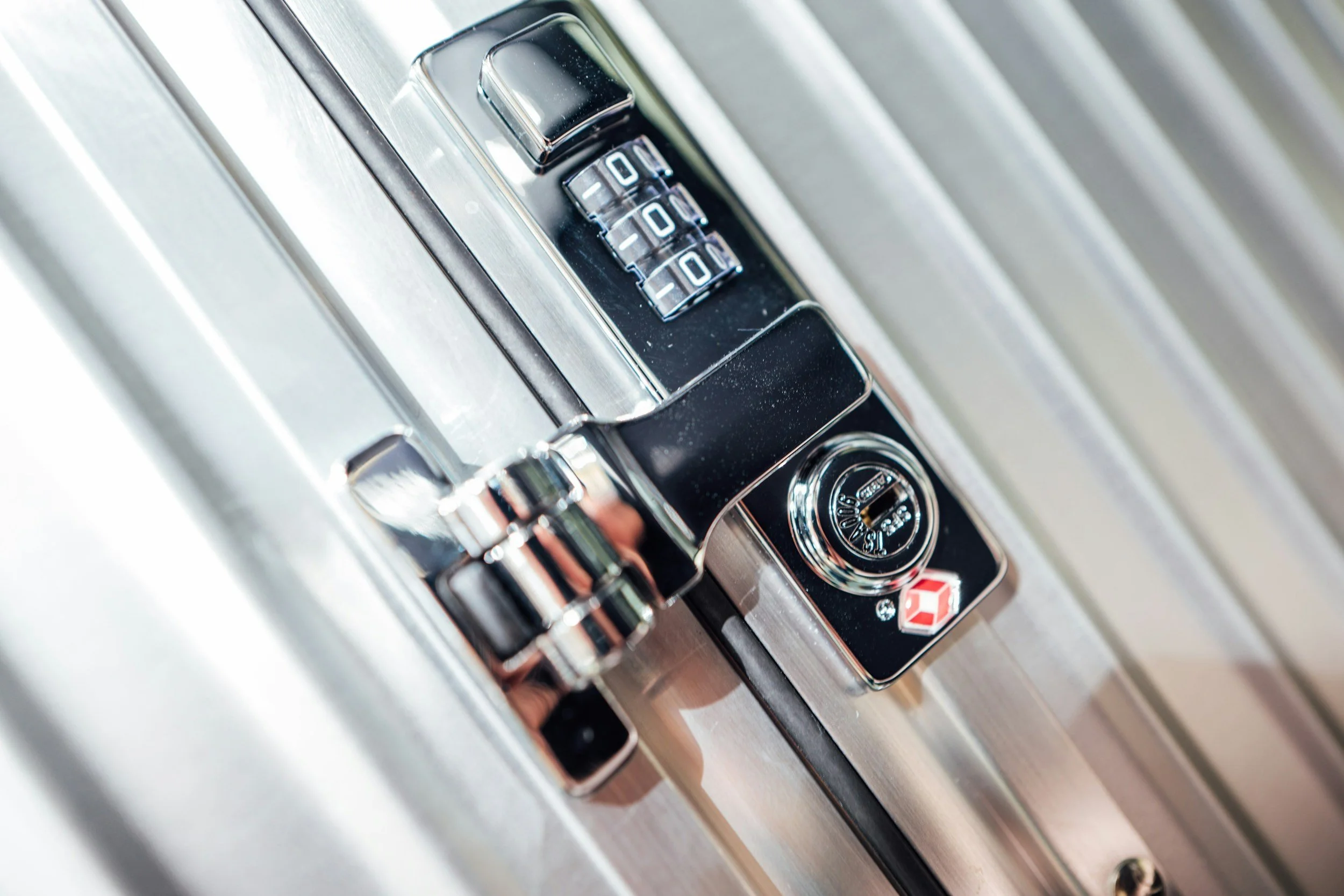 A close-up of a combination lock on a safe or secure box, with the numbers 0 3 and 0 visible on the dial.