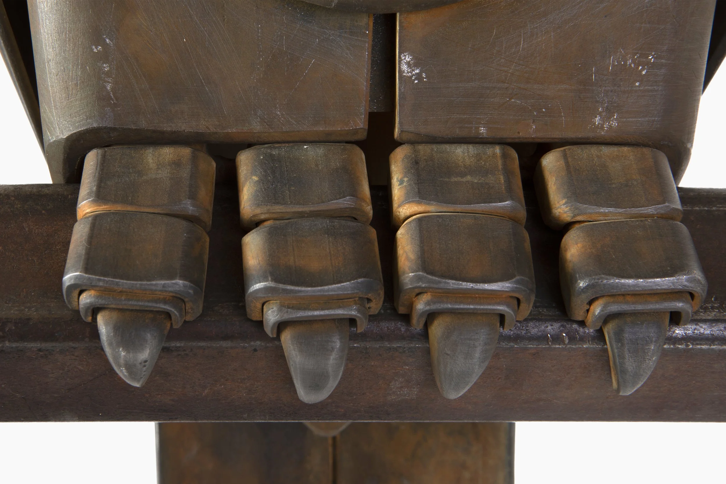 Close-up of an owl sculpture's talons.