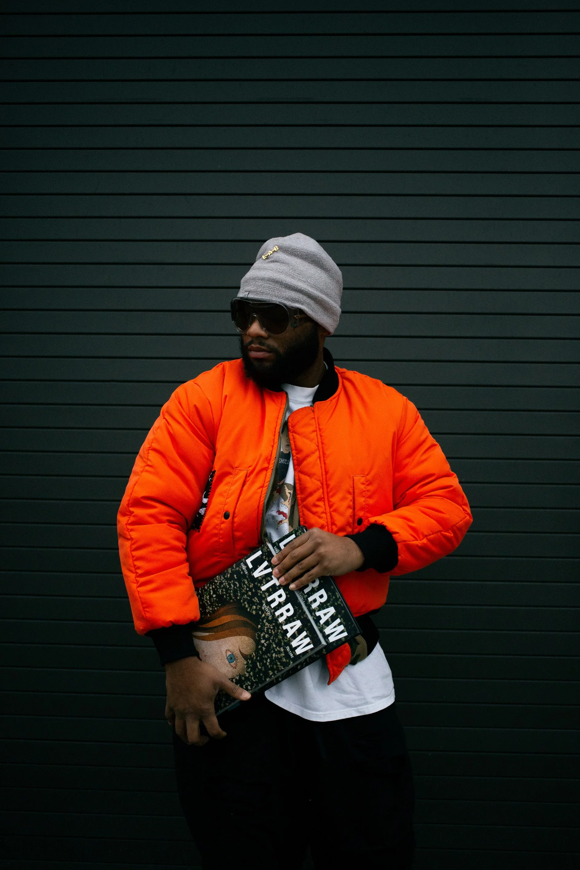 A bold creative portrait showcasing the Founder of Hunter Games and Founder & Creative Director of LVTRRAW®, reflecting street culture, fashion, storytelling, and leadership in sports and lifestyle branding.