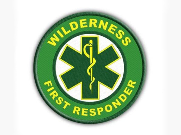 Wilderness First Responder patch with a green and yellow medical symbol and text.