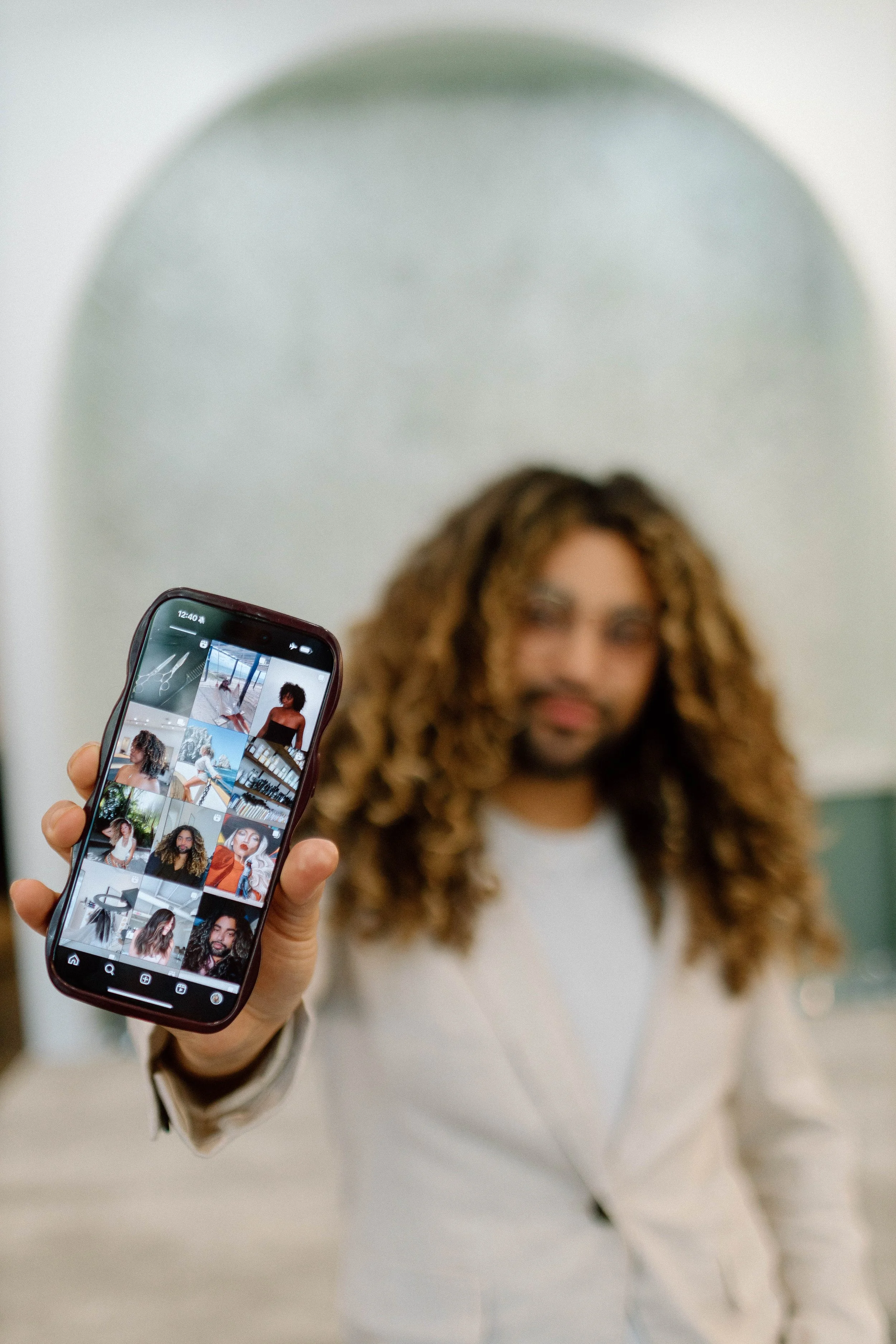 A curly hair specialist showcasing his portfolio at Collective Hair Co, Houston. A high-end salon specializing in color, textured hair, cutting, blow dry styling and extensions.