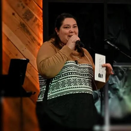 Pastor Aubrey Edwards, sharing announcements during a Sunday Service